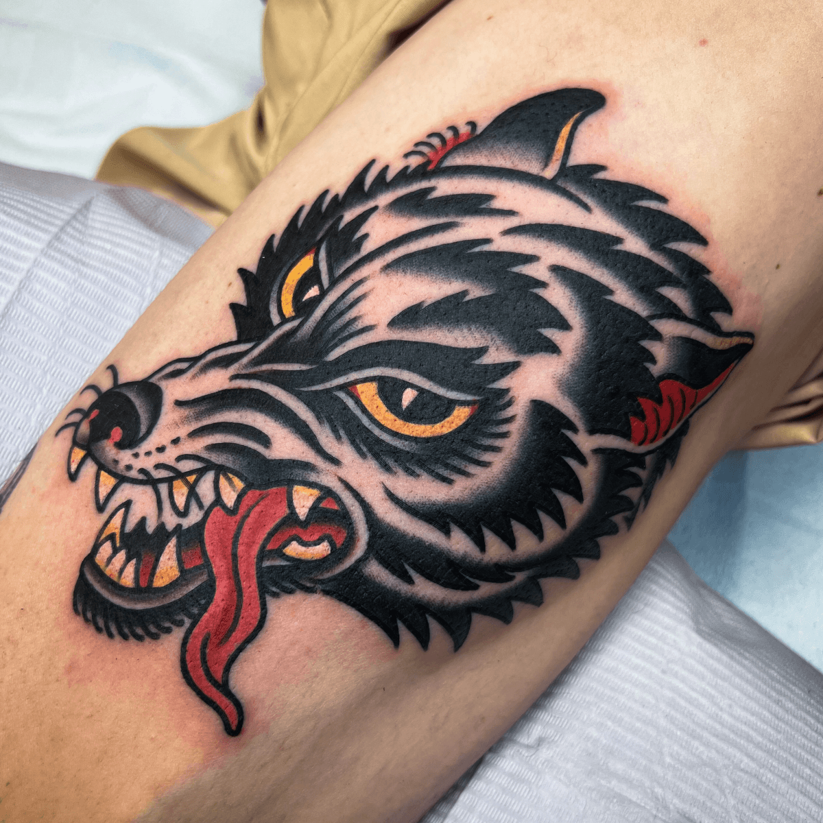 color tattoo of a wolf head