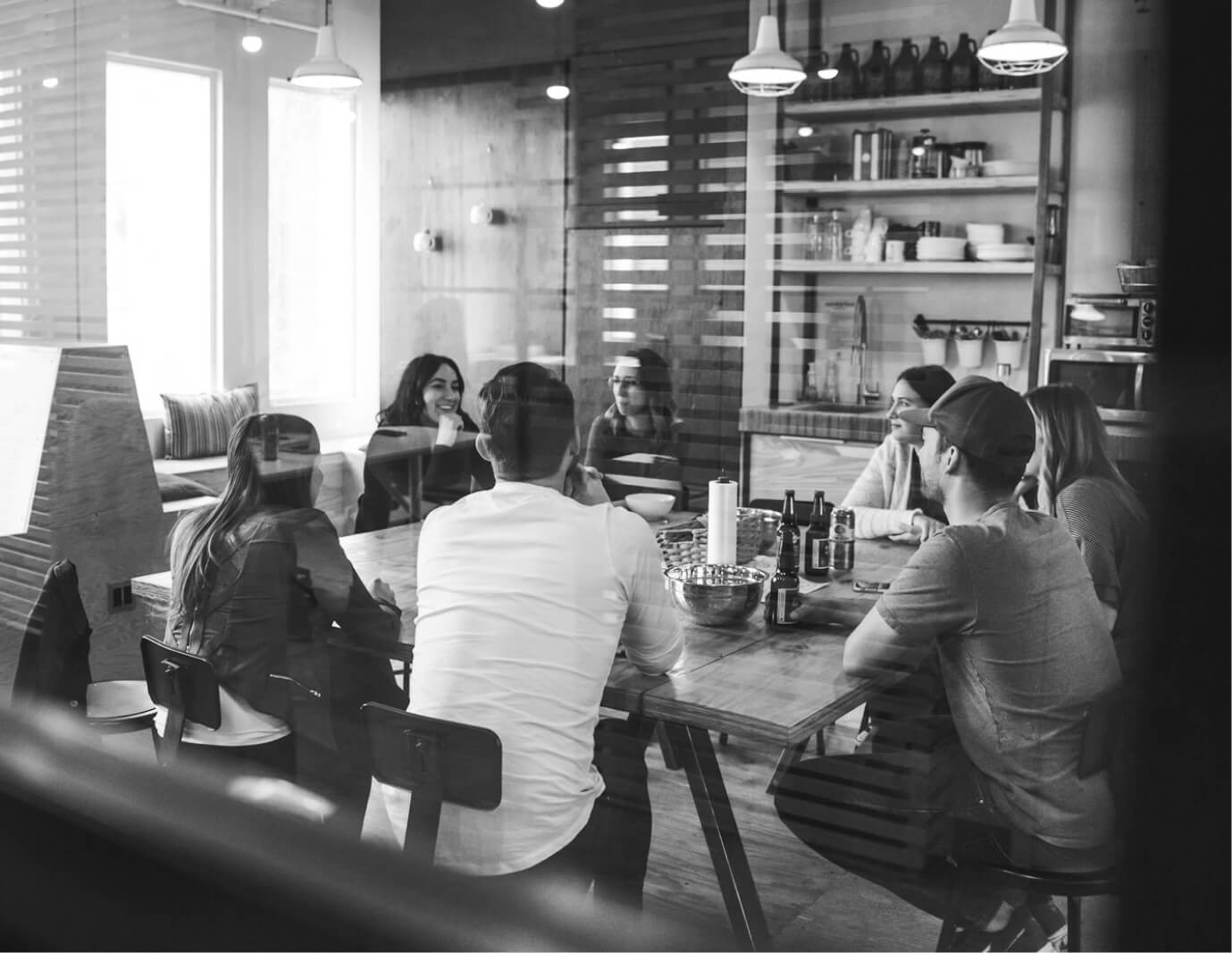 Interior of a cafe or workspace with several people at tables