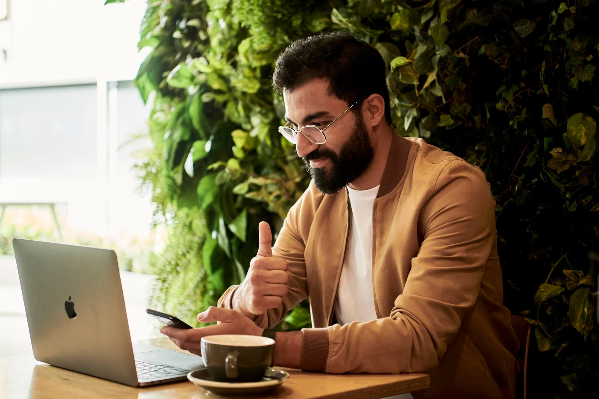 Man with laptop and coffee