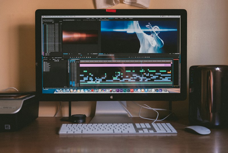 Creative desktop workspace with an iMac and editing setup