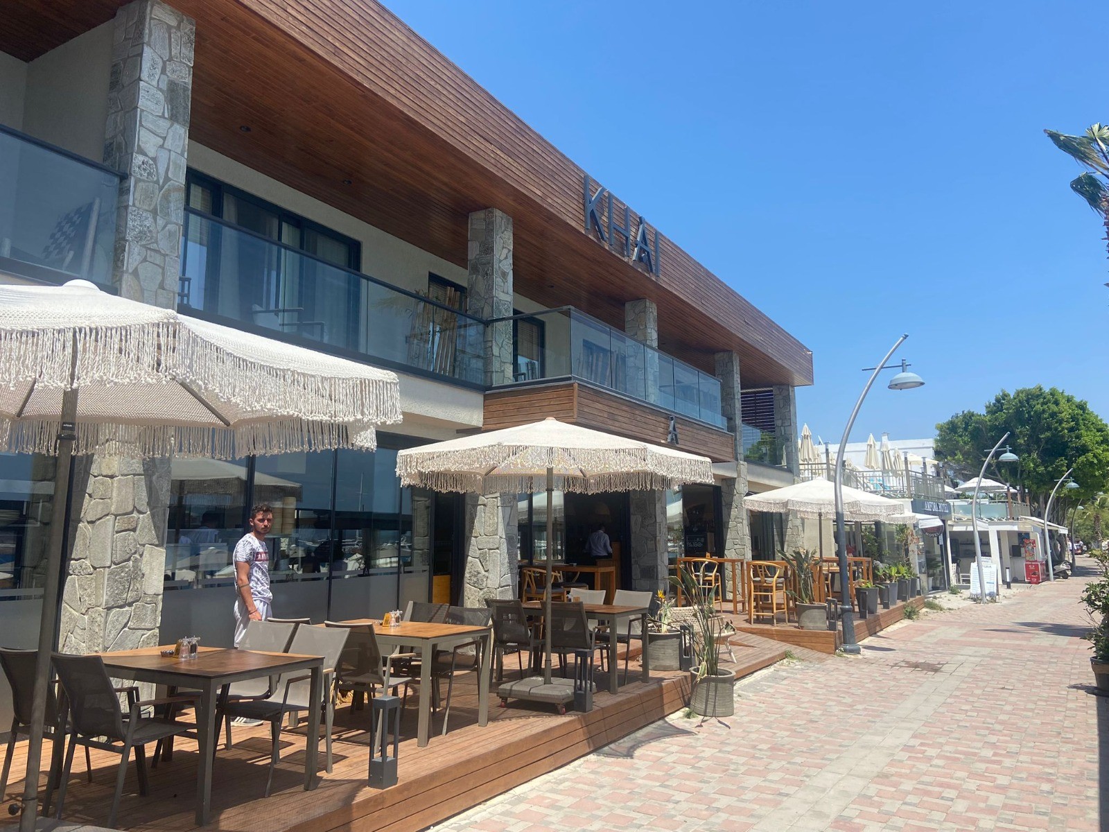 two people looking at a tablet and smiling