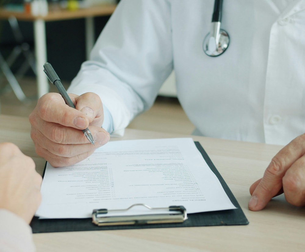 Physician reviewing paperwork