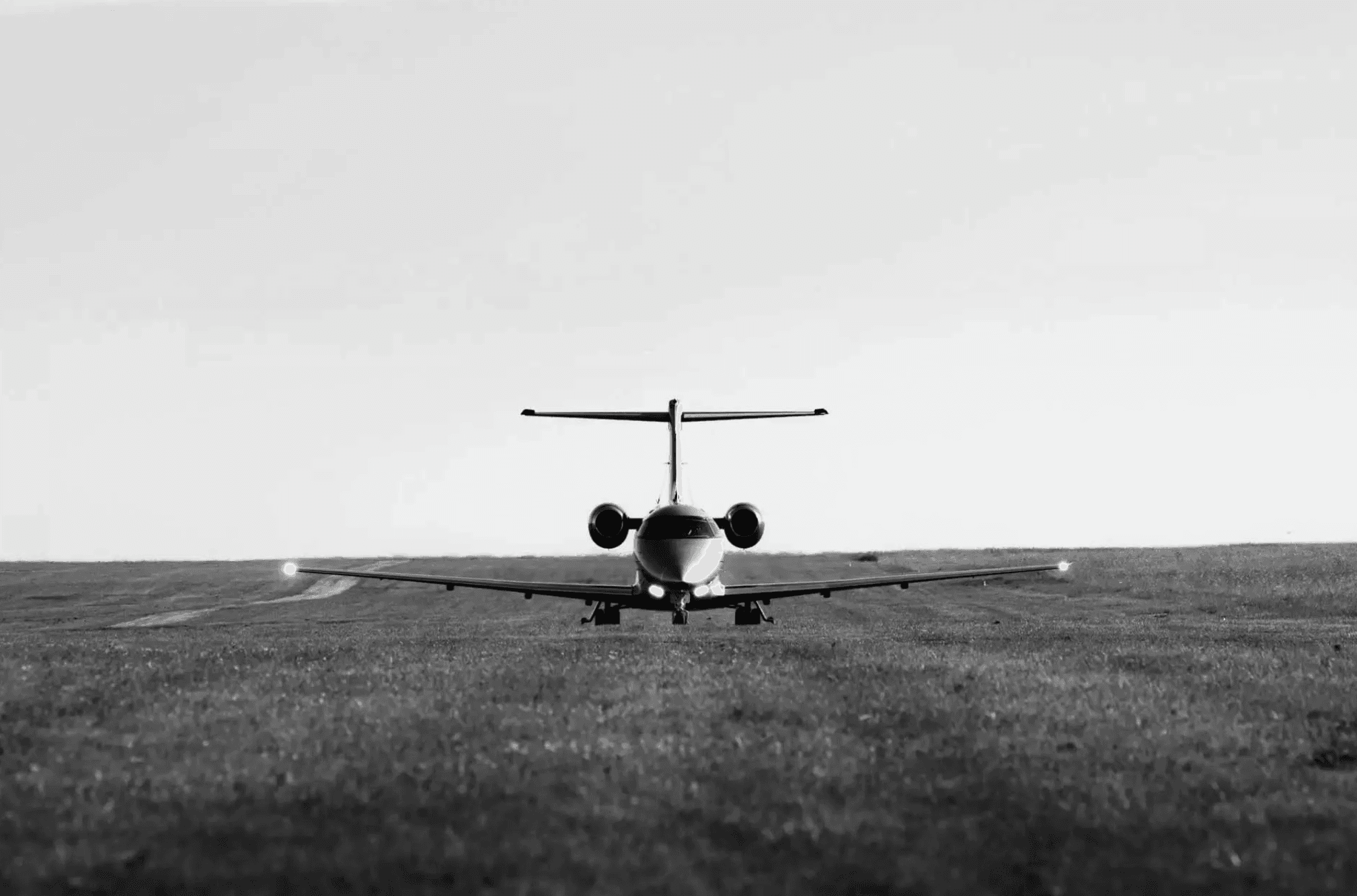A Pilatus PC-24 operating on a grass runway.