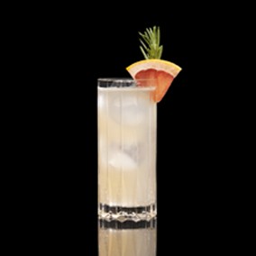 A closeup of a Halston drink against a dark background.