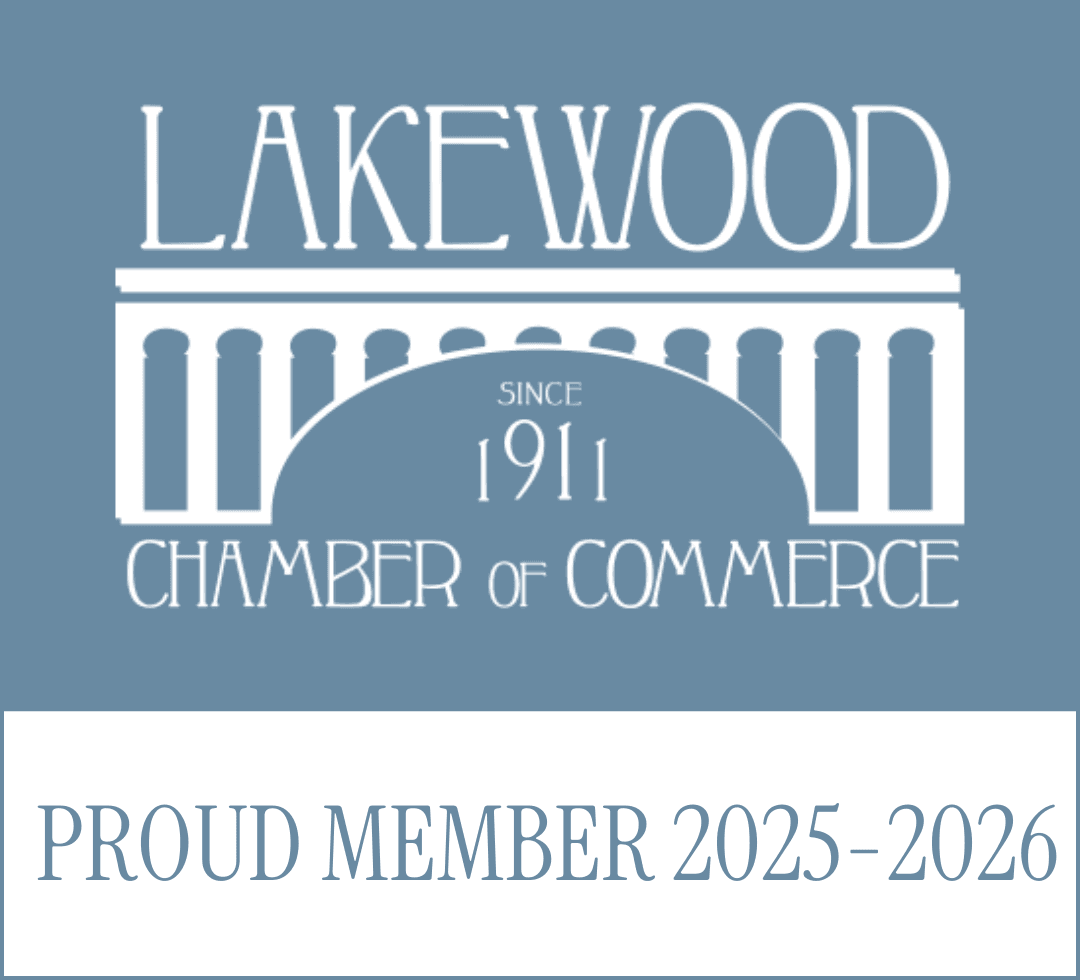 Portrait of medium brown and white dog on pink background