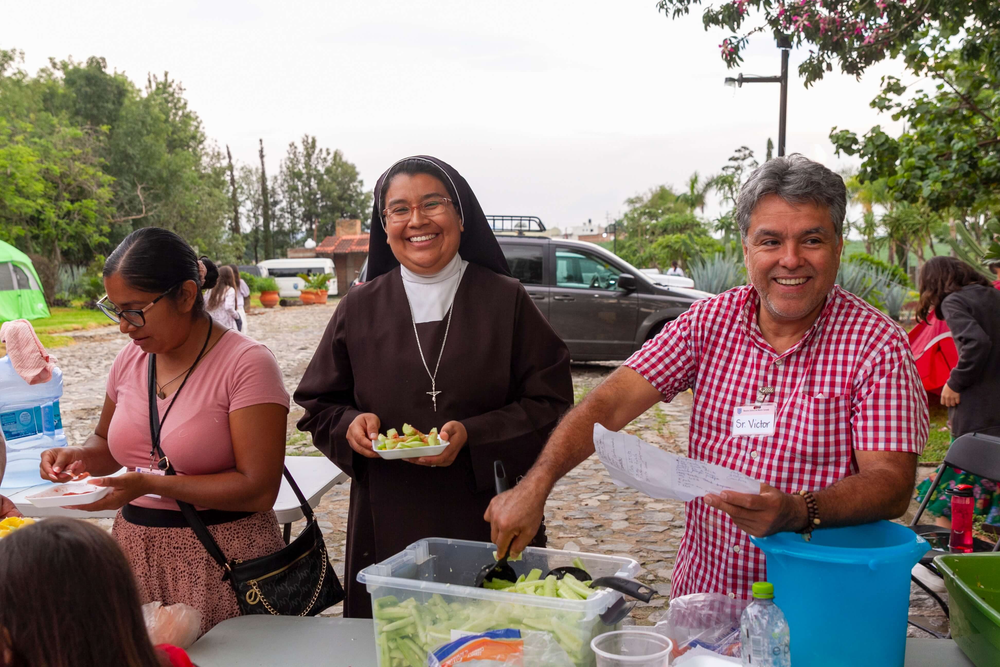 a group of children sitting on steps in front of a building