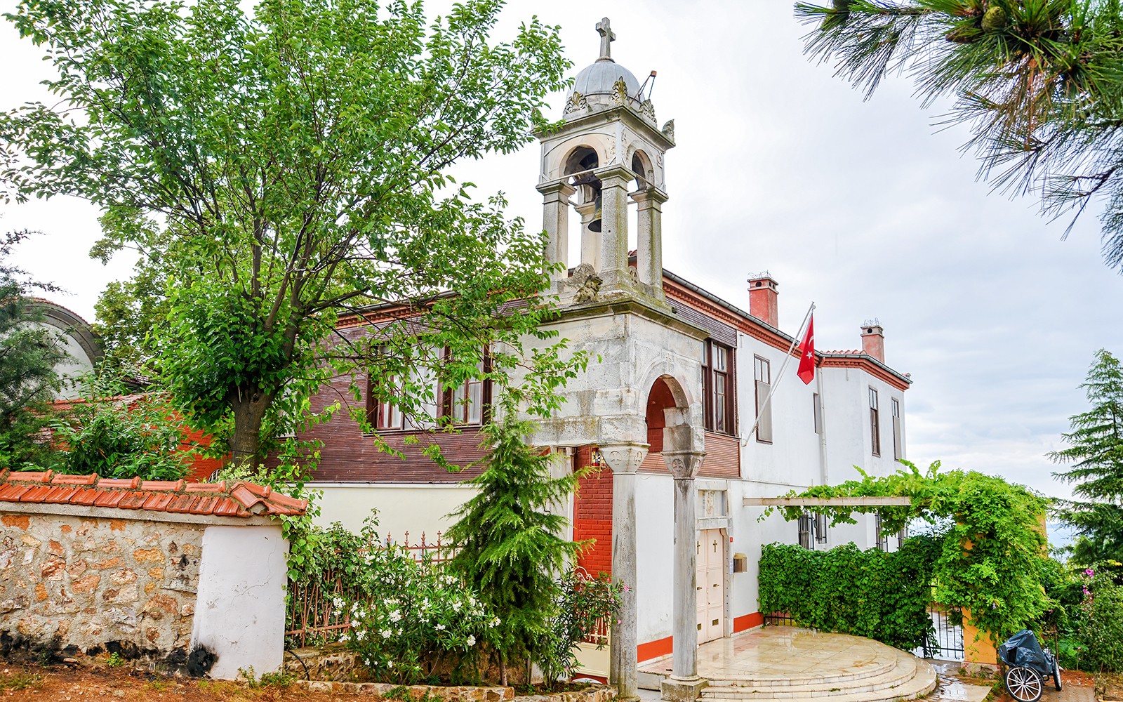 Aya Yorgi Monastery exterior with bell tower and Turkish flag, Buyukada.
