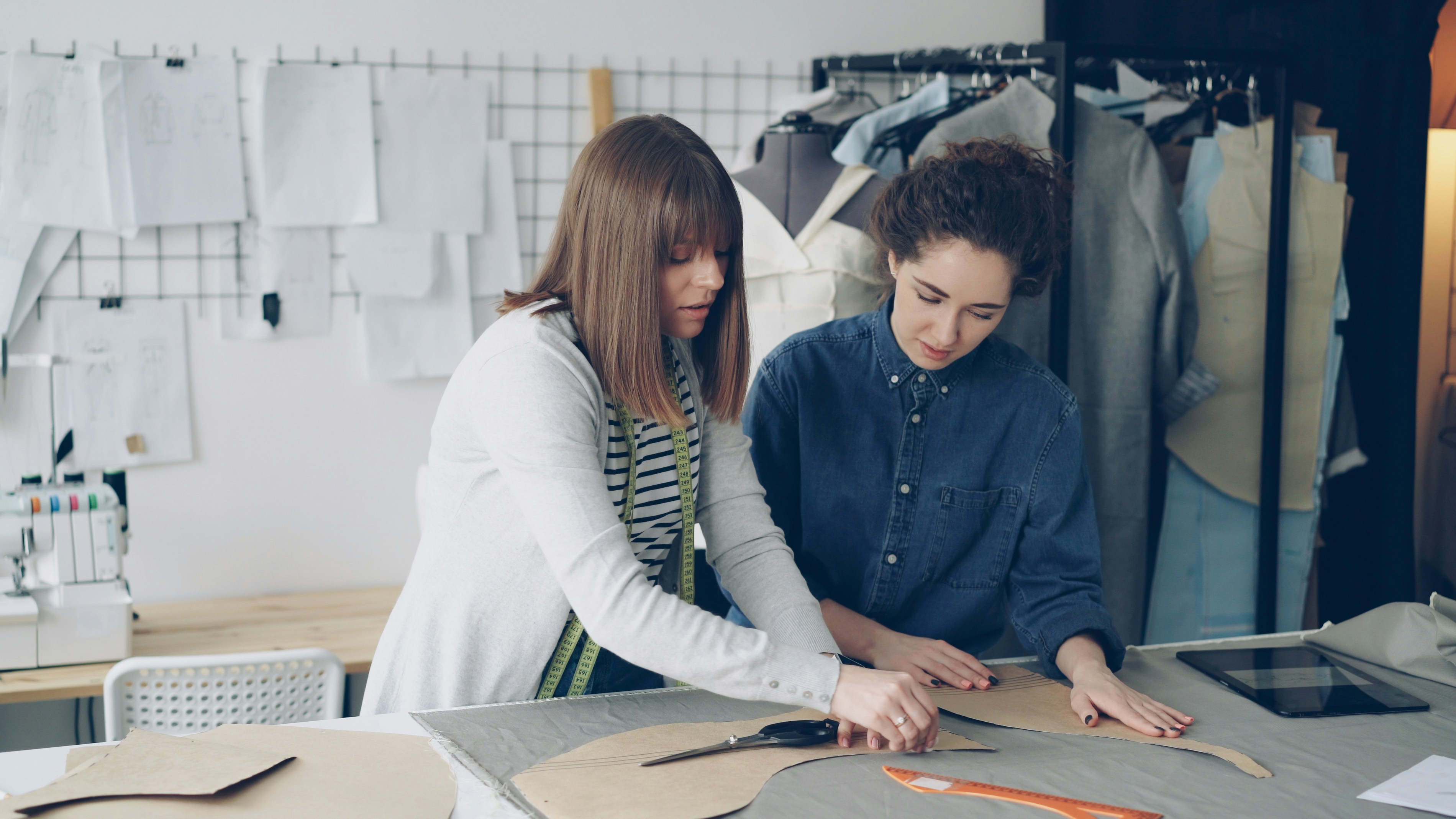 Fashion designers work together on a project.