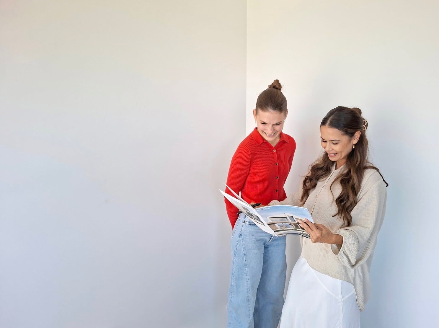 Roof repair technician in high-vis vest working on-site.