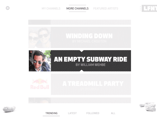 A screenshot of a social media interface displays three featured artists: “Winding Down” by Michael Croxton, “An Empty Subway Ride” by William Wehbe, and “A Treadmill Party” by Jeffrey Dudule. Below the artists, the interface shows “MY CHANNELS” and “TRENDING” tabs, with “Trending” highlighted in green. White stones are visible in the bottom left and right corners.