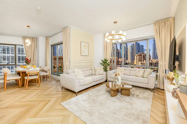 Example design direction: cream, sand, light oak and brass living room