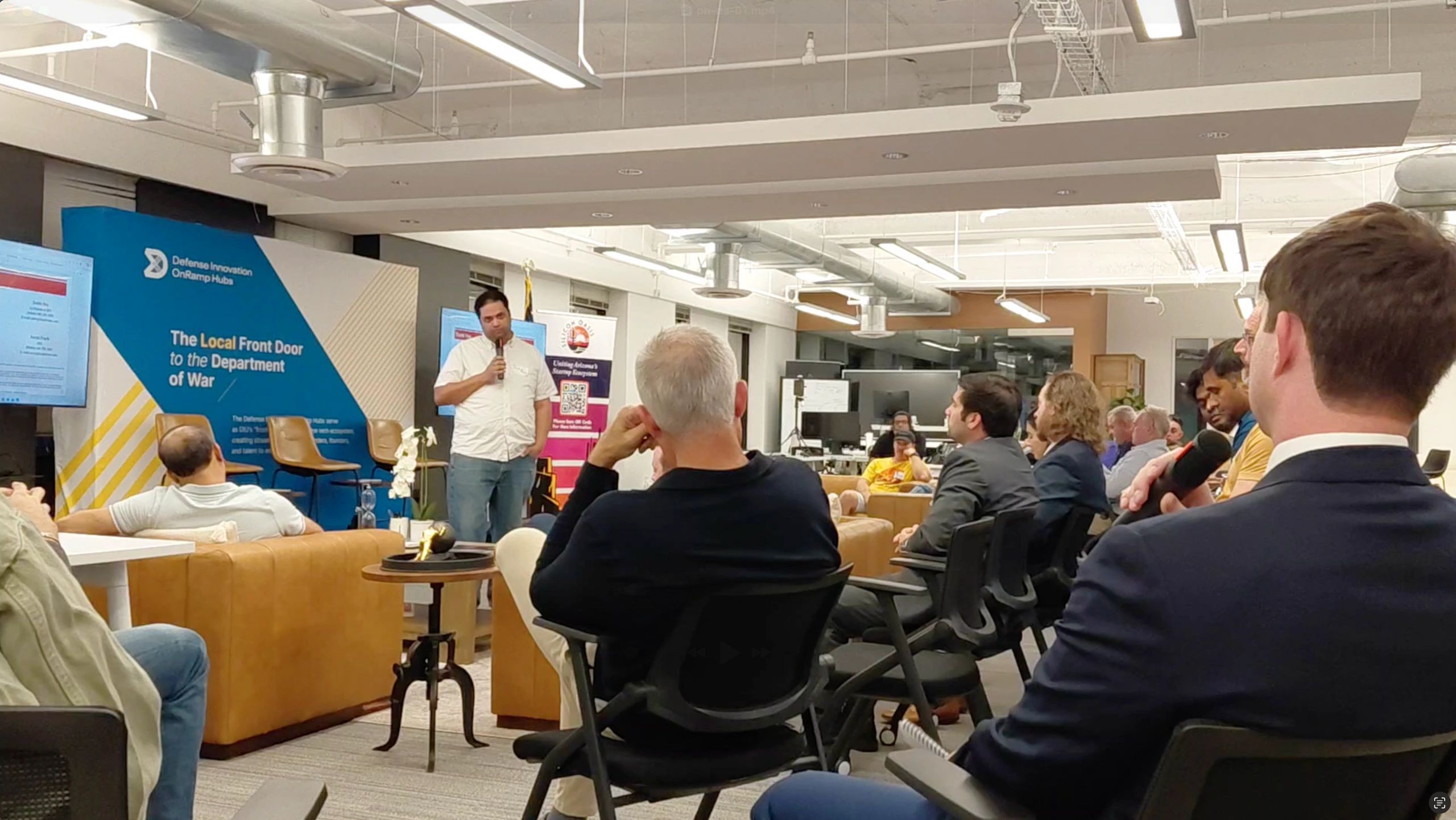 a black and white living room with a large tv