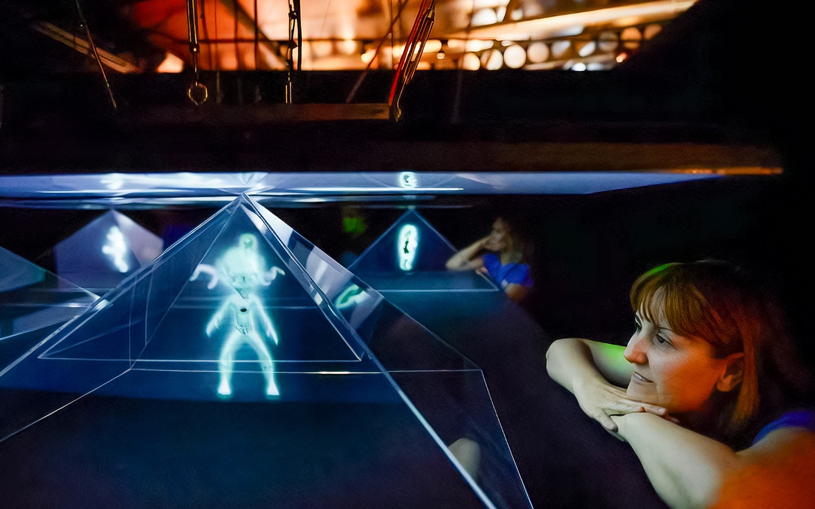 Visitors observing holographic display at Valencia Science Museum, part of Oceanogràfic and Hemisfèric combo tickets.