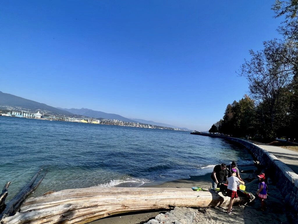 A family enjoying their day out along Vancouver's seawall walk.