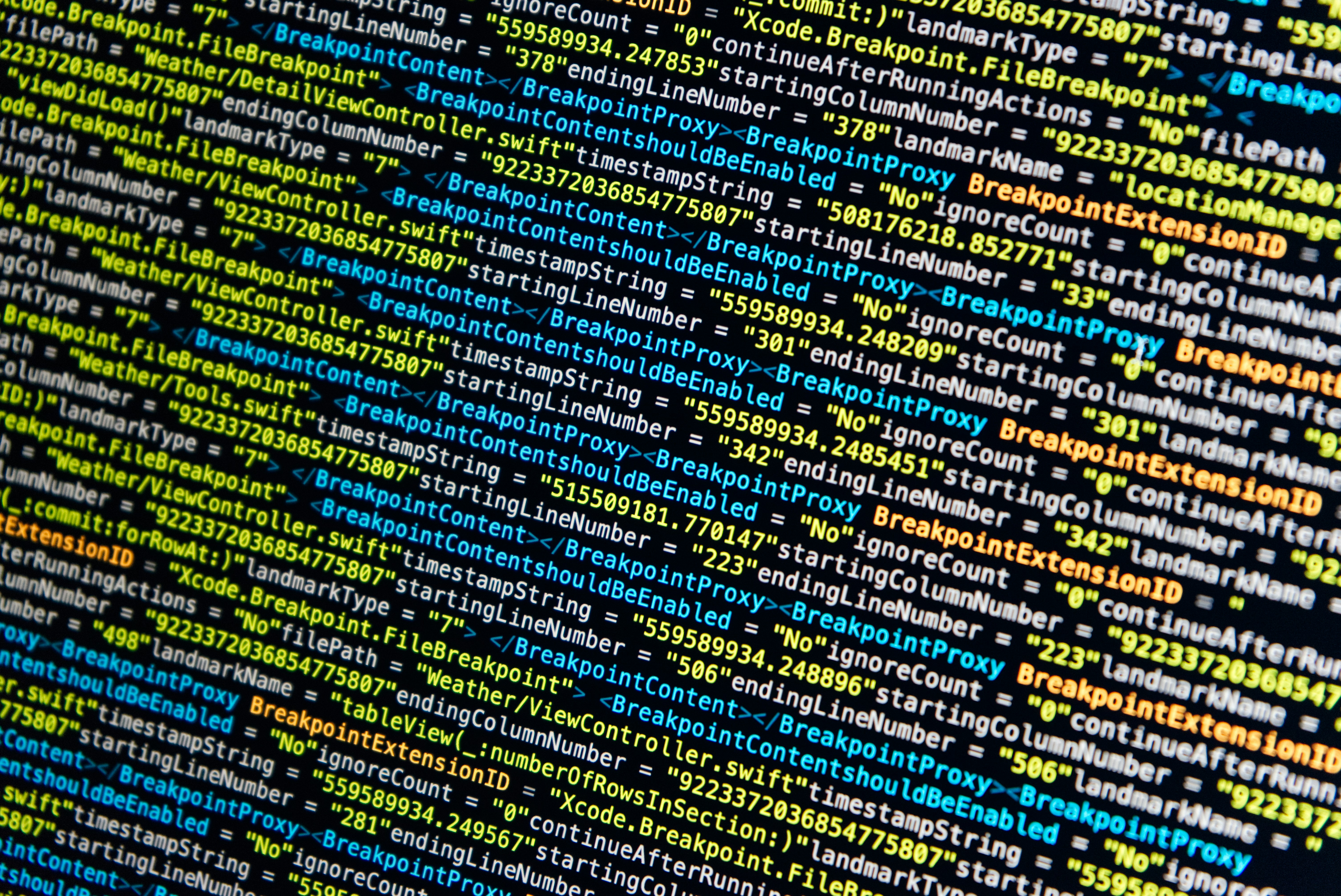 turned-on monitor displays source codes