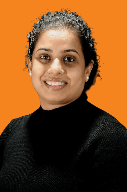 A serene portrait of a person with short dark hair and a silky high-collared outfit, set against a softly blurred background.