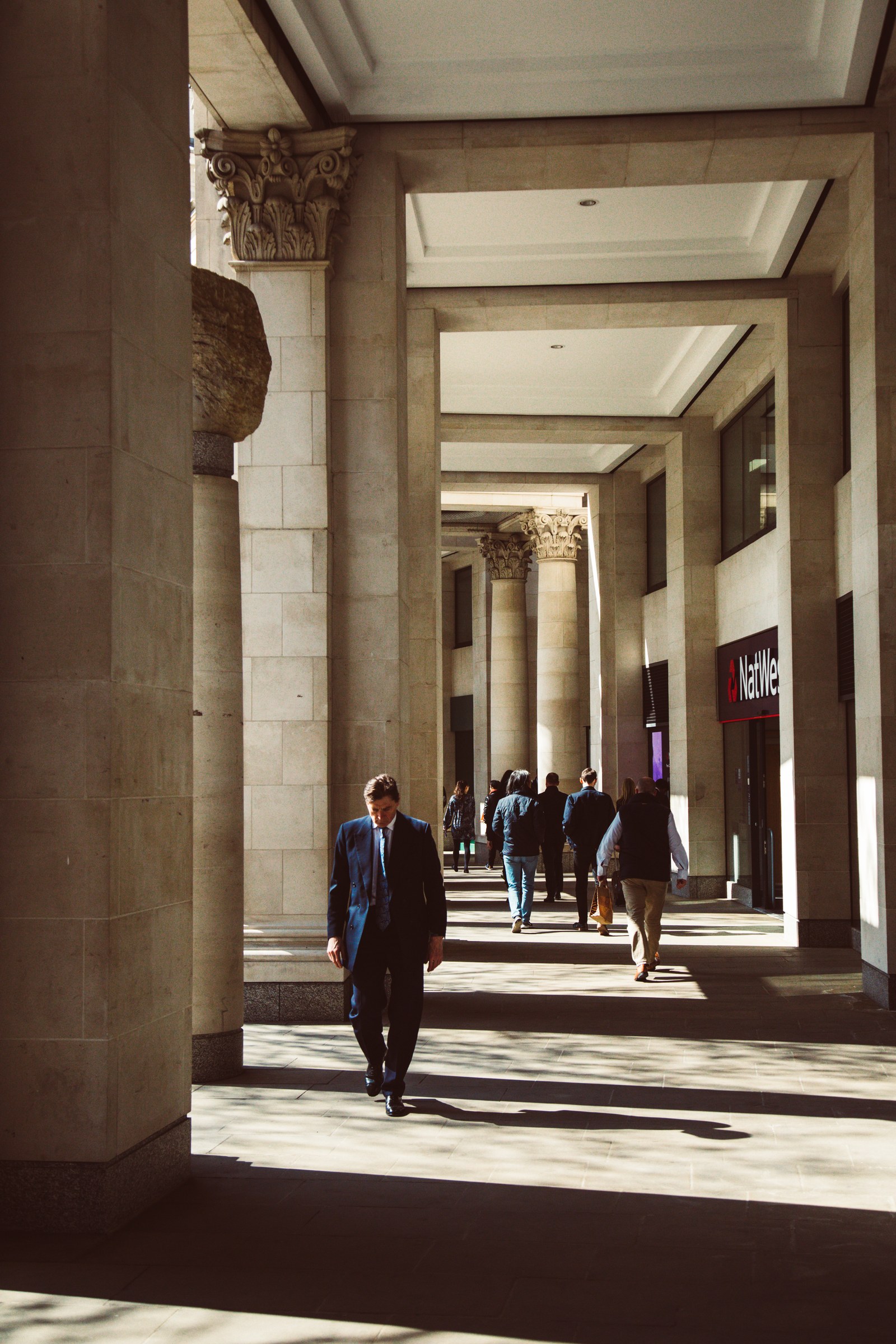 TRAVEL · Afternoon light through a colonnade.
