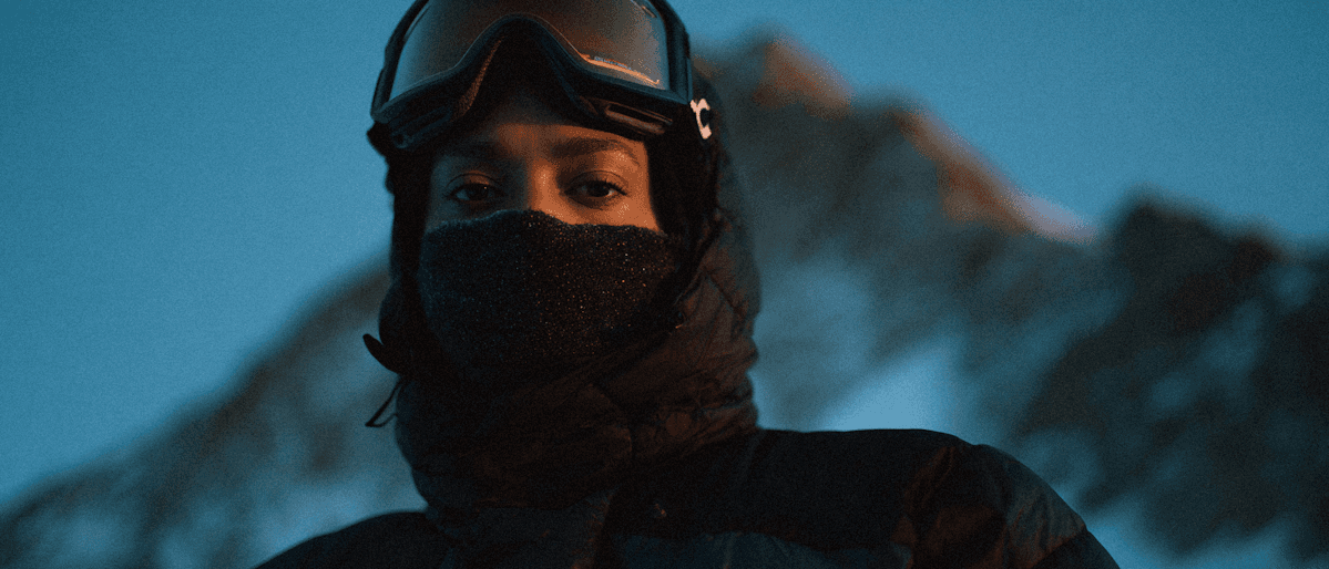 A person in winter gear with ski goggles