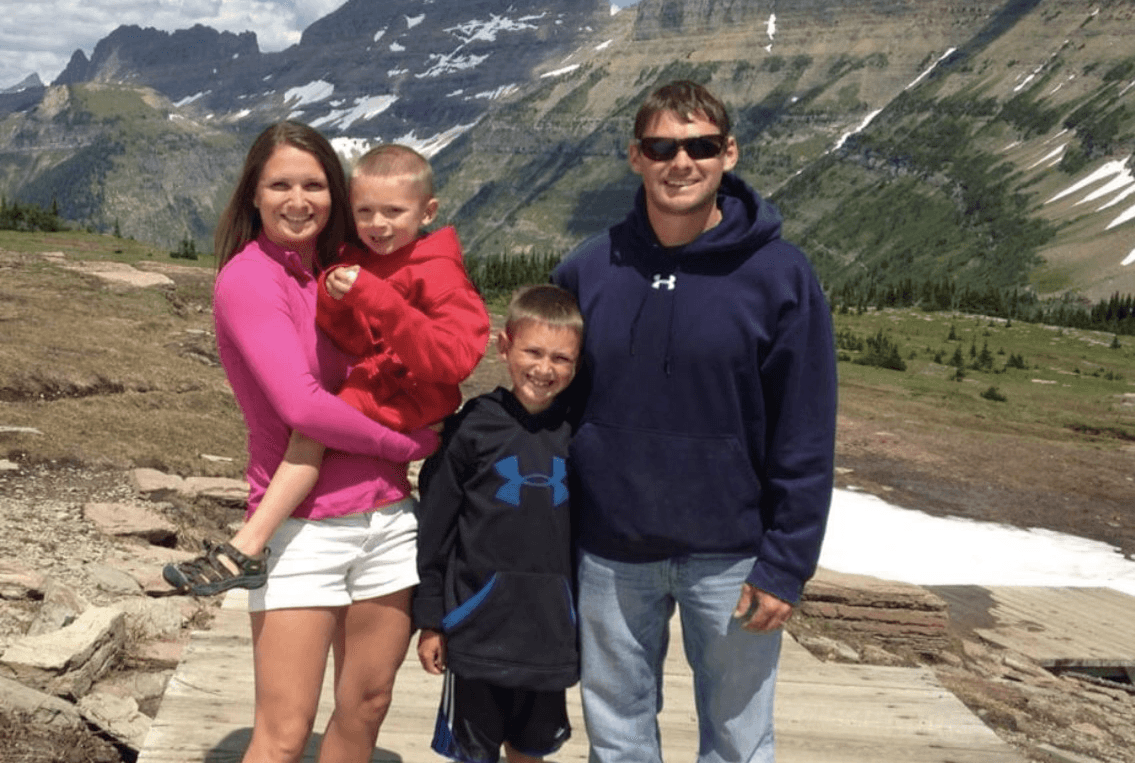 Anne with her husband Chad and their two young sons, Ethan and Will, hiking in Glacier National Park, Montana