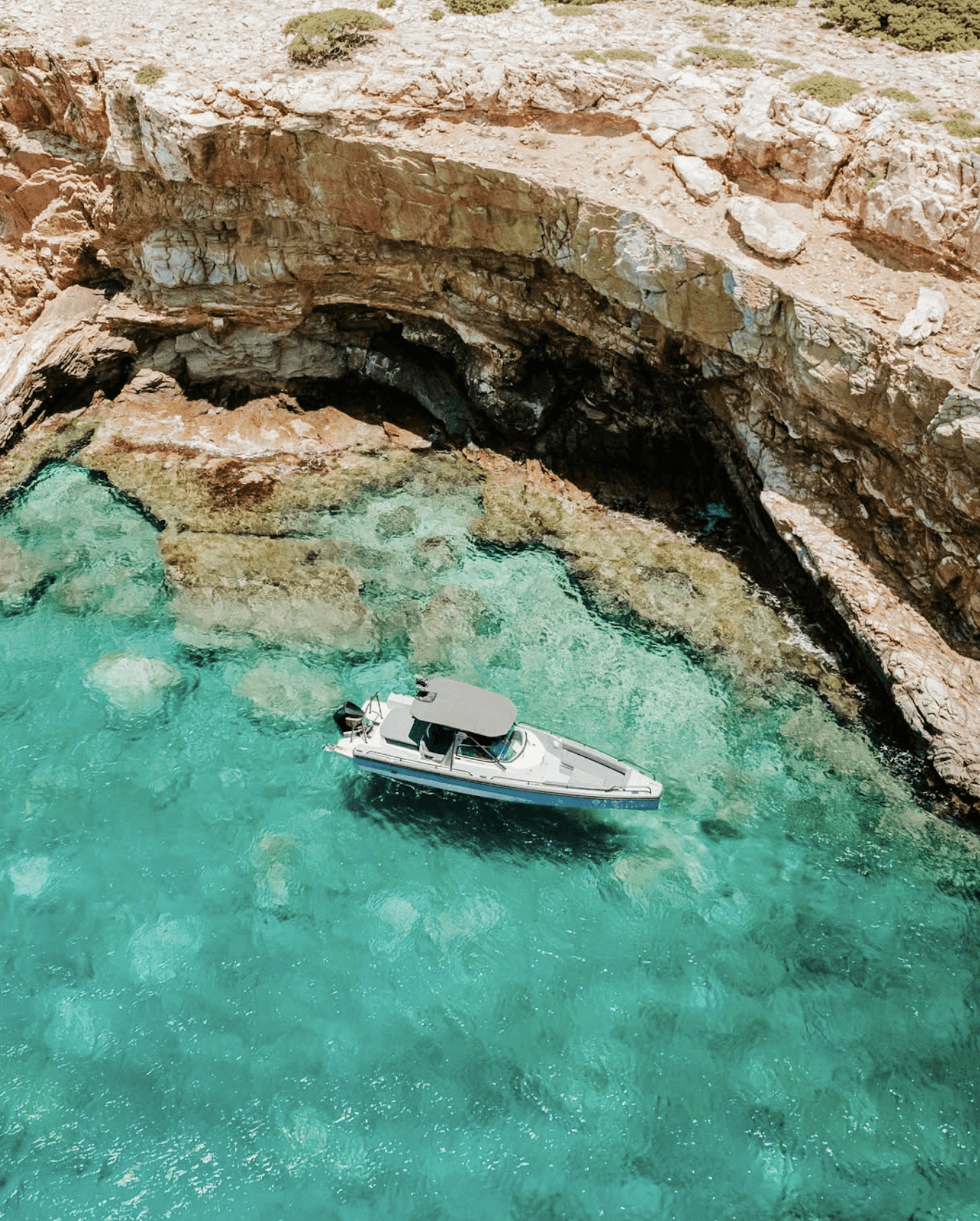 High-speed RIB boat floating in the turquoise waters.