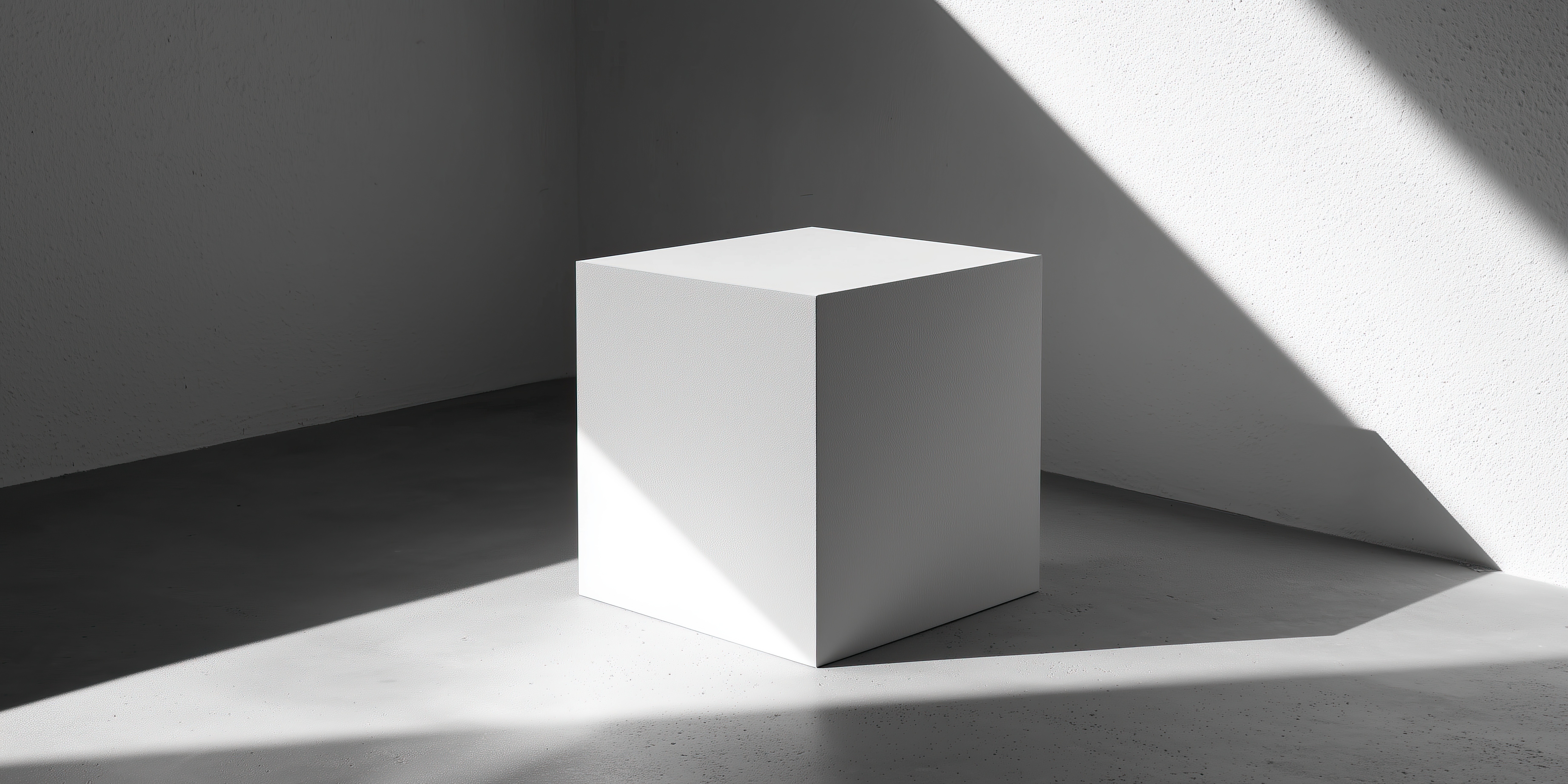 Minimalist composition with a white cube in a corner, with strong light casting sharp shadows on the floor and wall.