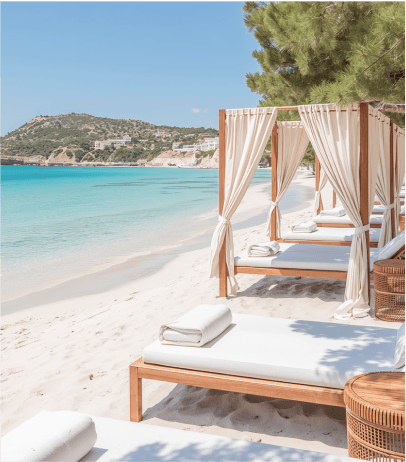 Comfortable bean bags by a pool with palm trees and a beach view.