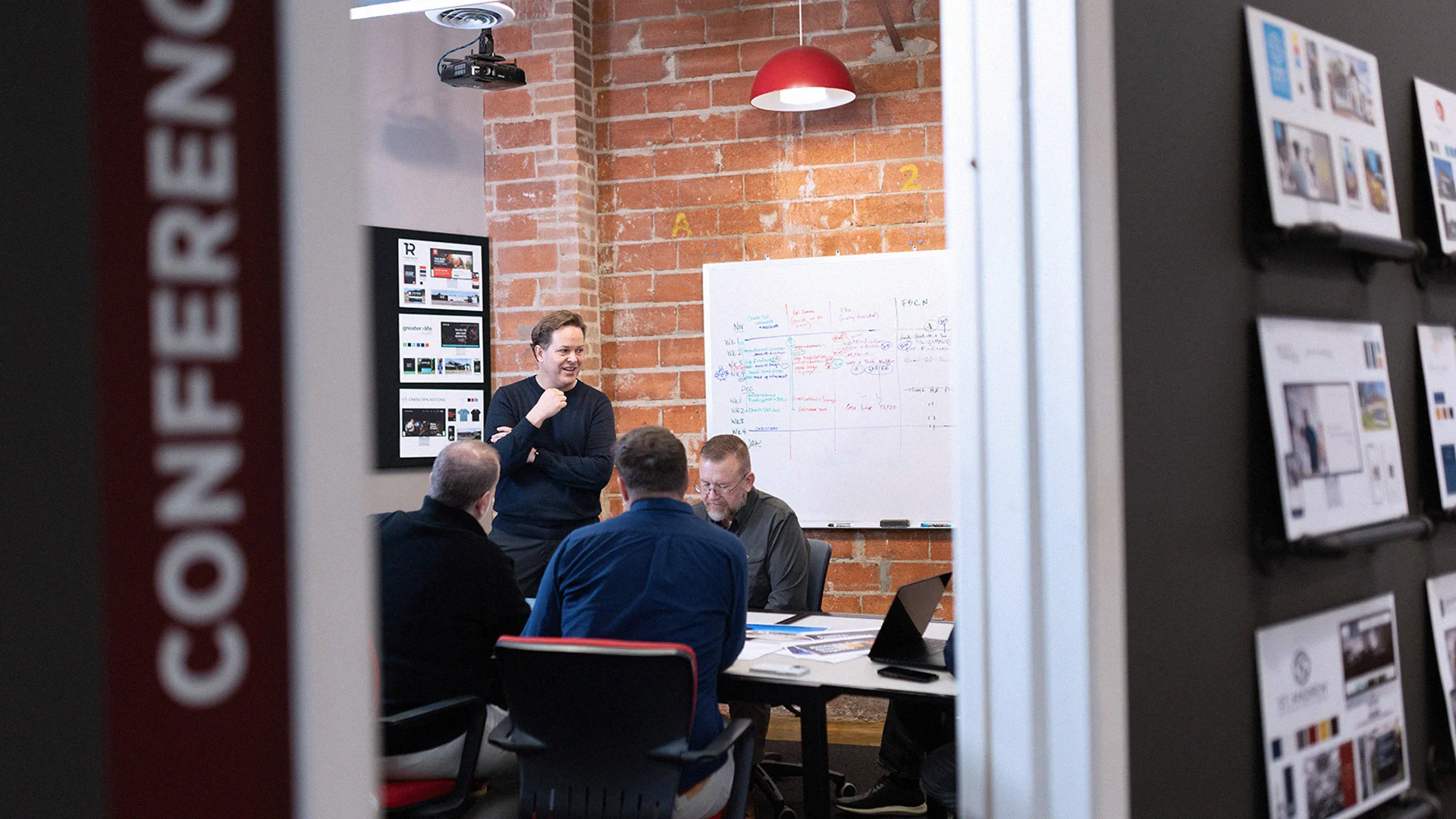 An implementation partnership meeting with church consultants in a conference room