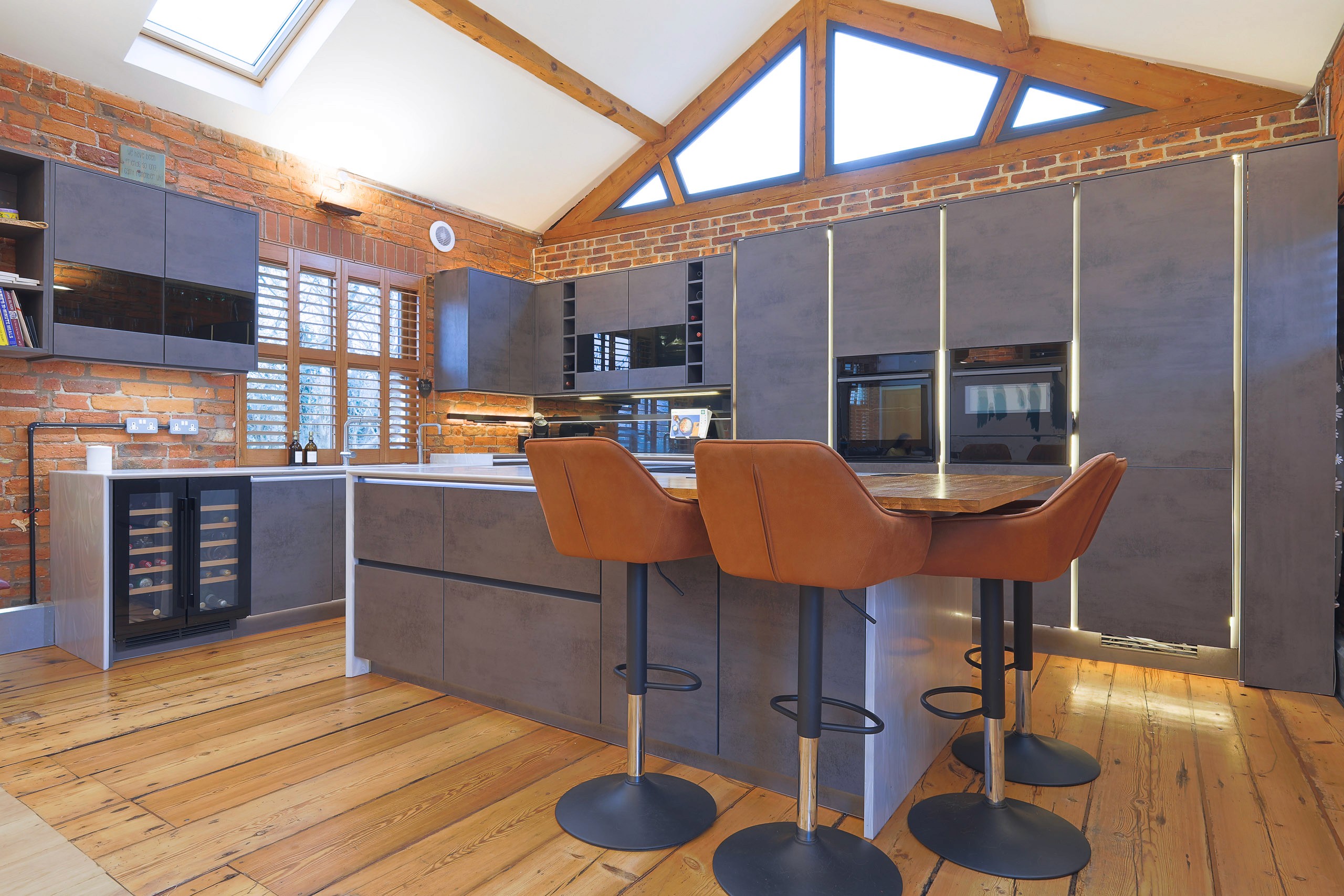 modern handleless concrete kitchen with corian worktops in wilmslow cheshire 