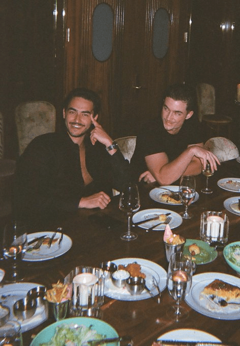 Luke Alexander at dinner with a co-founder