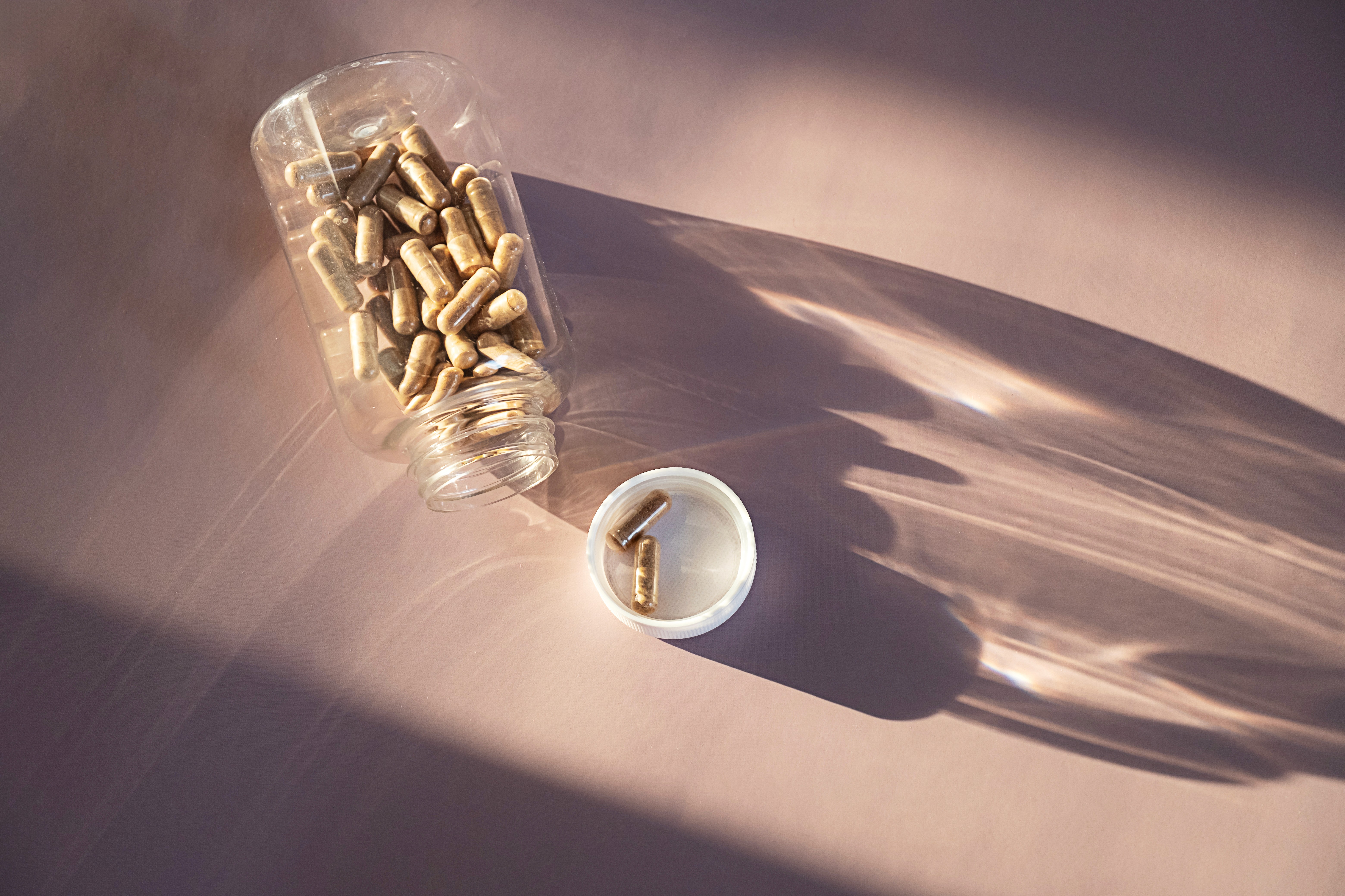 a bunch of pills sitting on top of a table