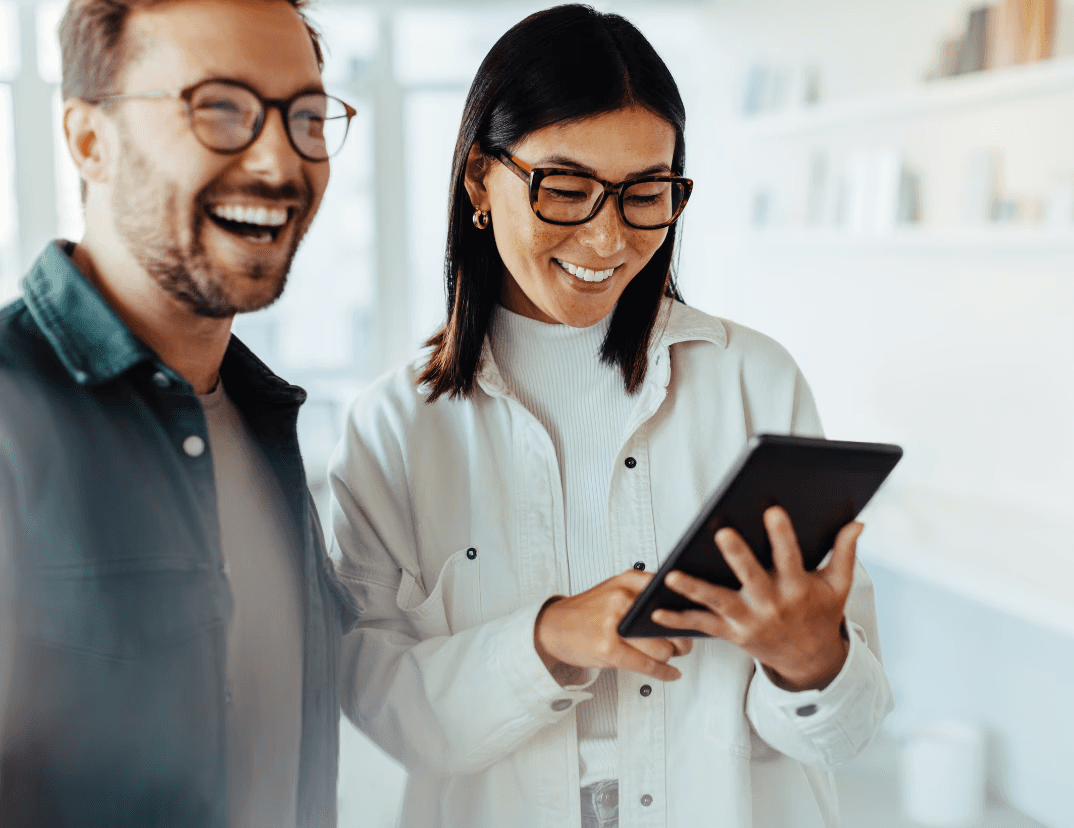 three younger people working on their laptops