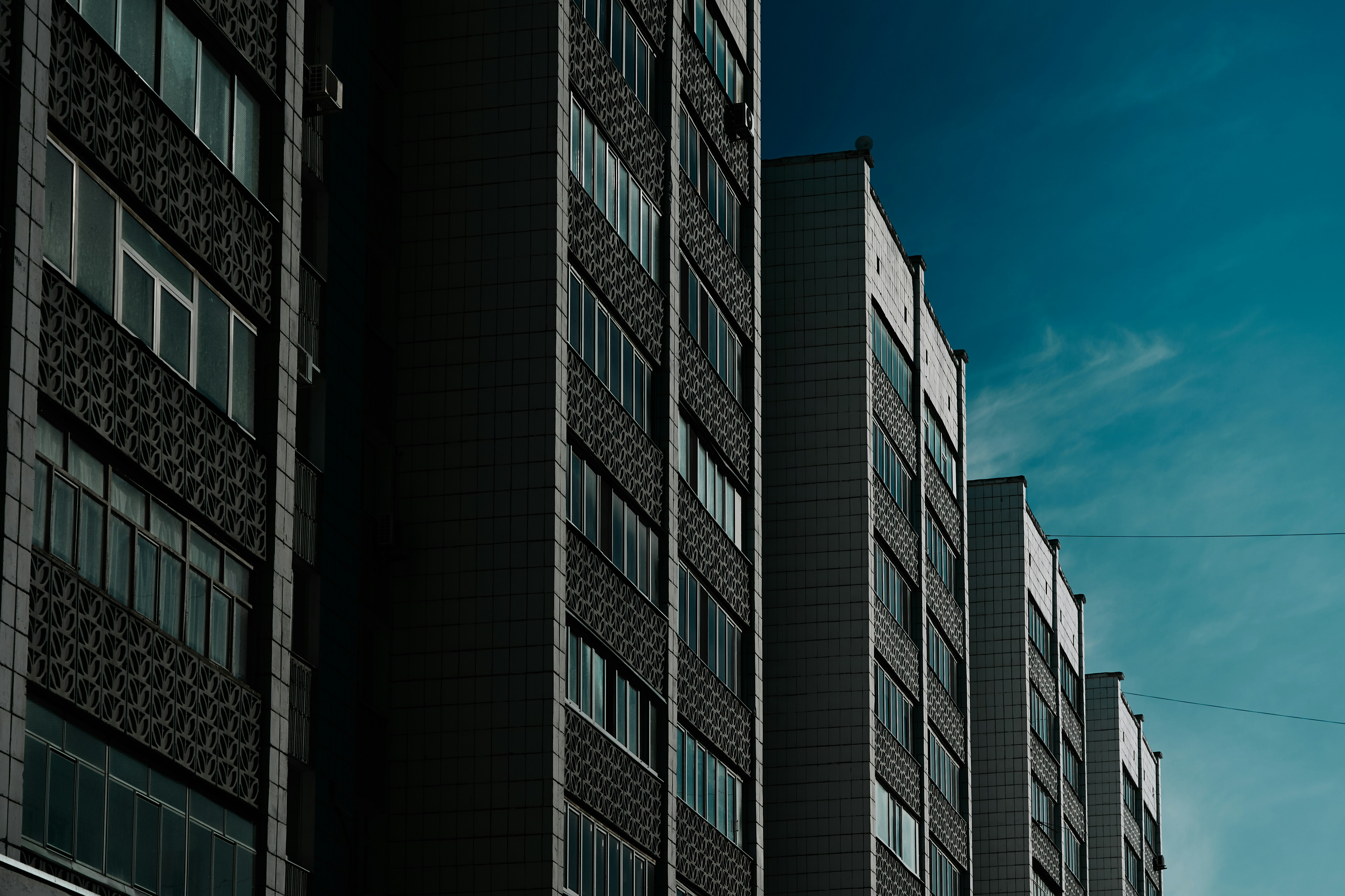 a tall building with a clock on the side of it
