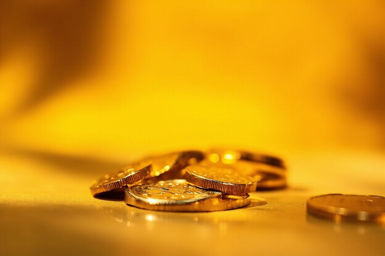 Gold coin being securely transferred online, symbolizing a safe digital transaction.