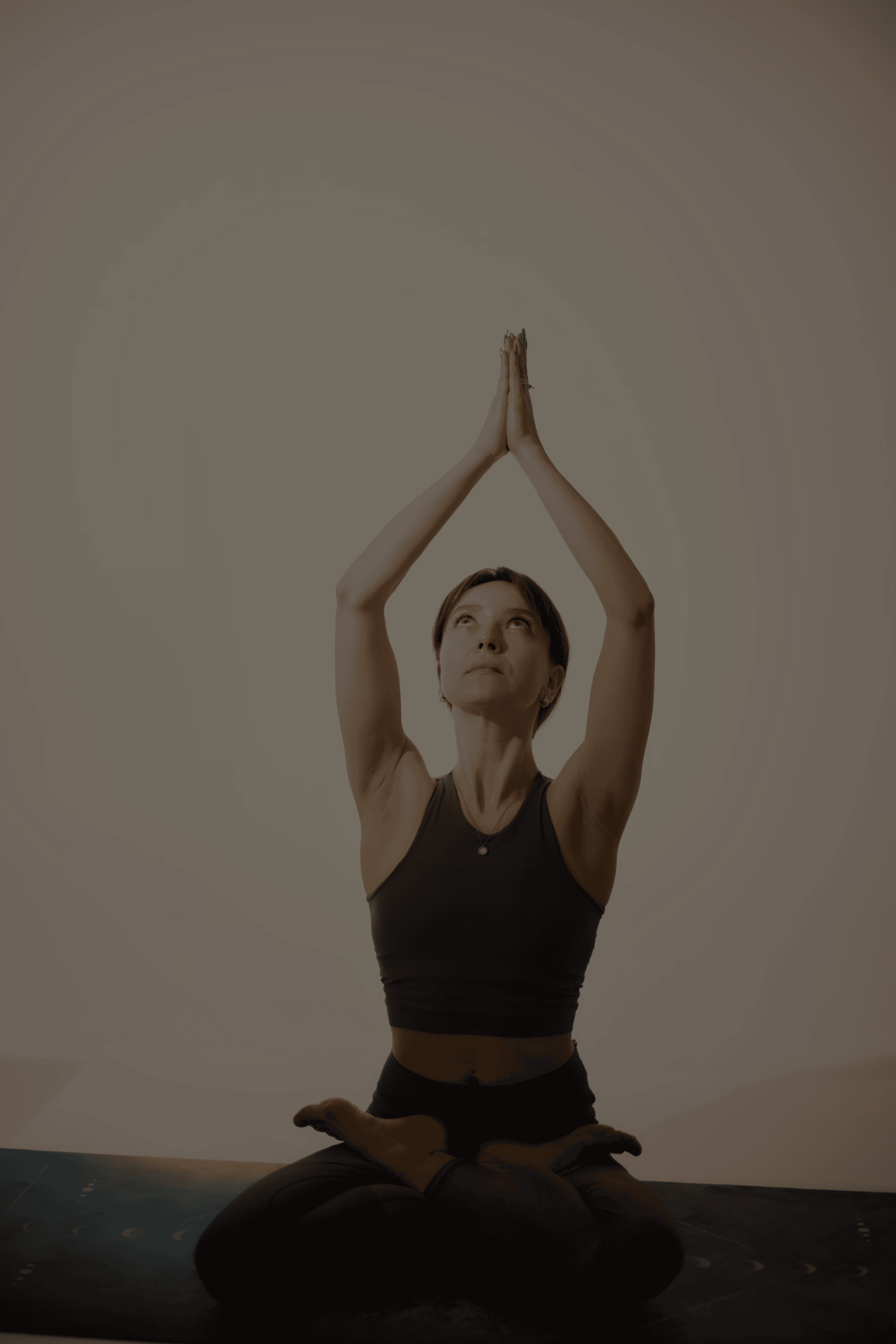 a woman is doing a yoga pose on the floor