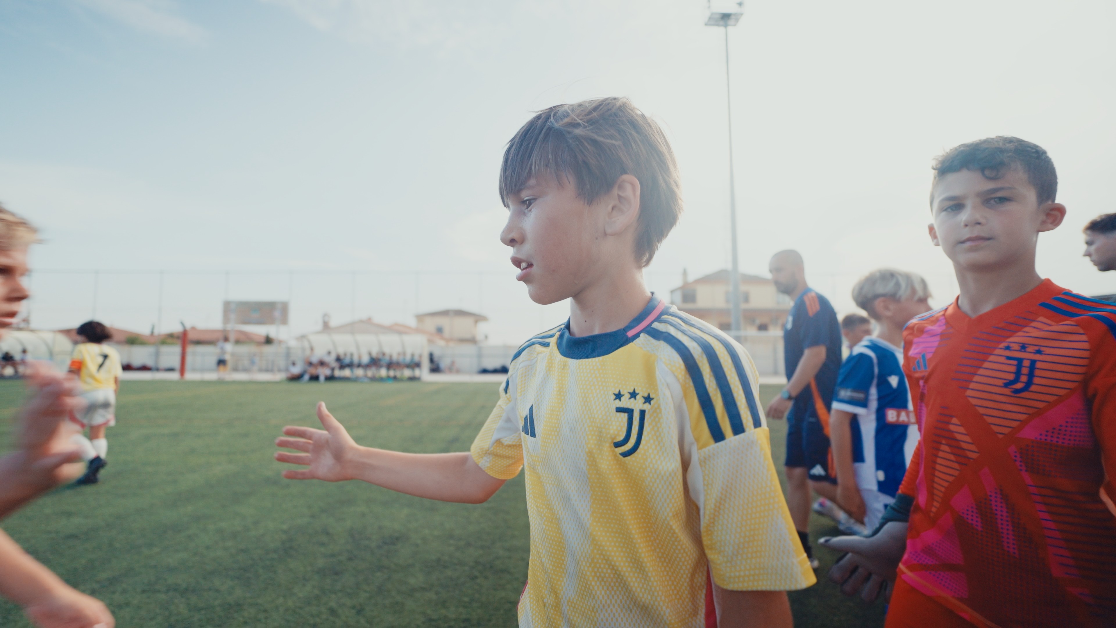 A woman in a helmet with a light trail, suggesting movement or speed in a dynamic outdoor setting.