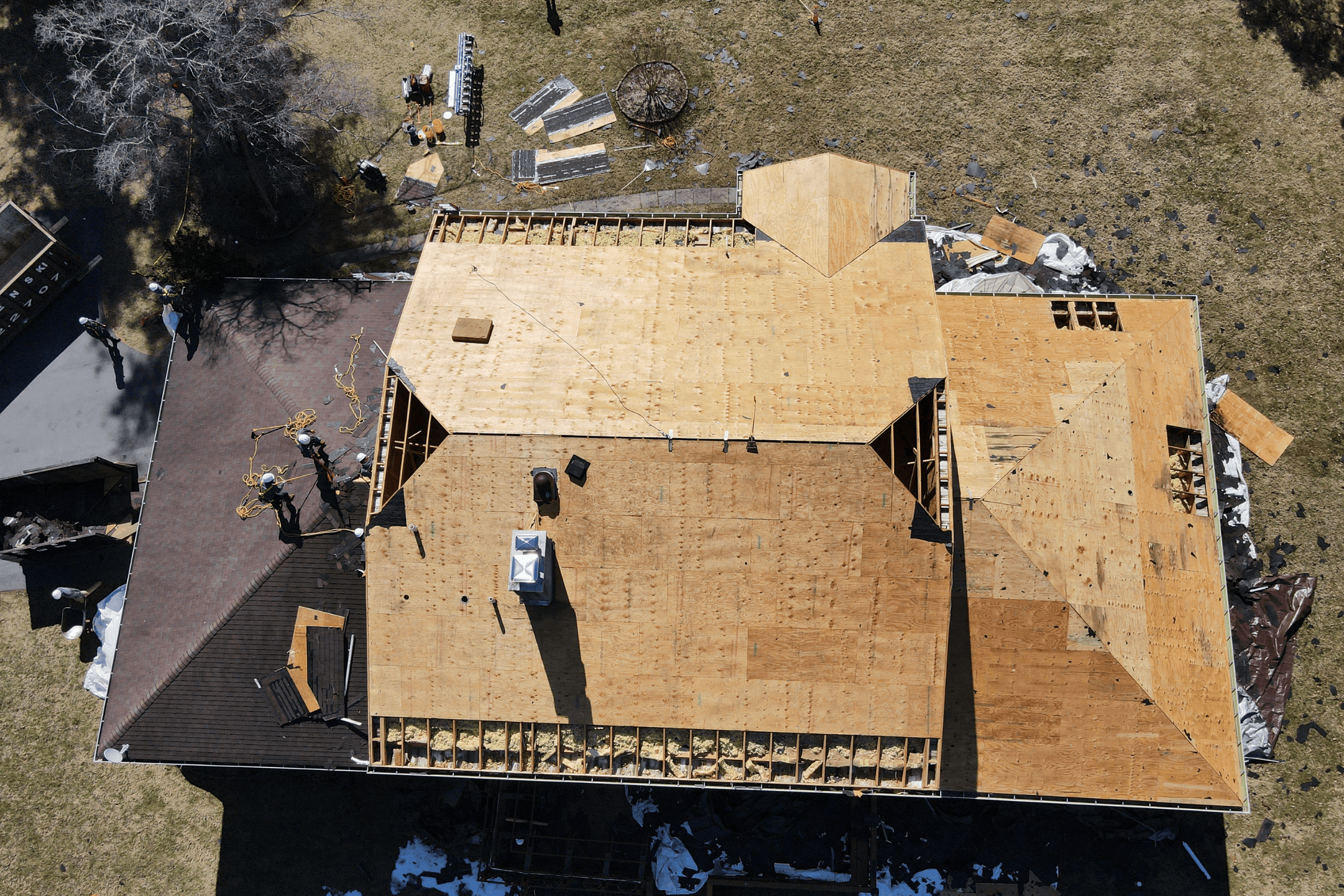 Tearing off roof and removing rotten decking for wood replacement before shingle install in Kansas City, Missouri