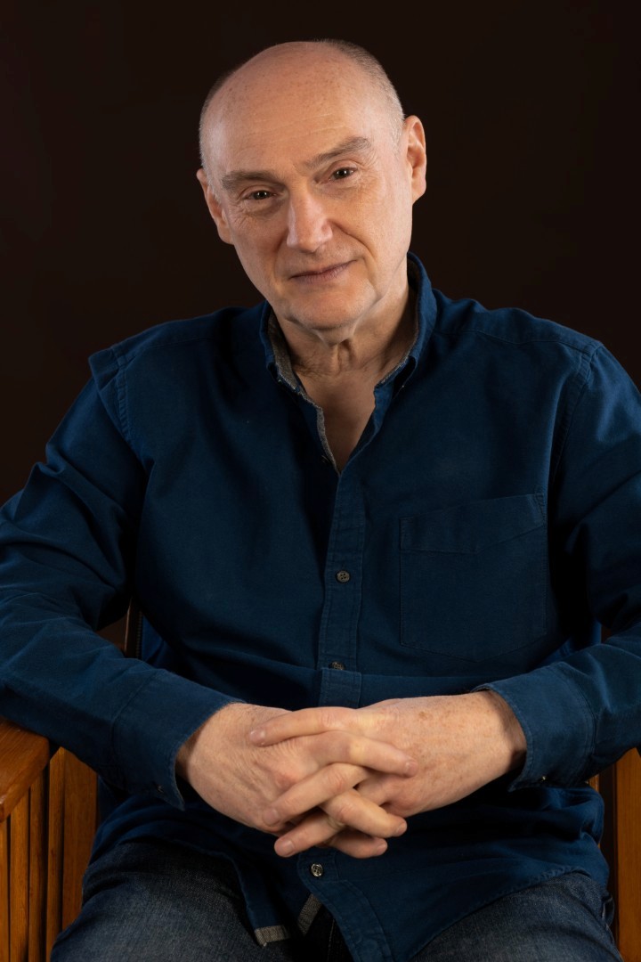 A man having his portrait taken. 