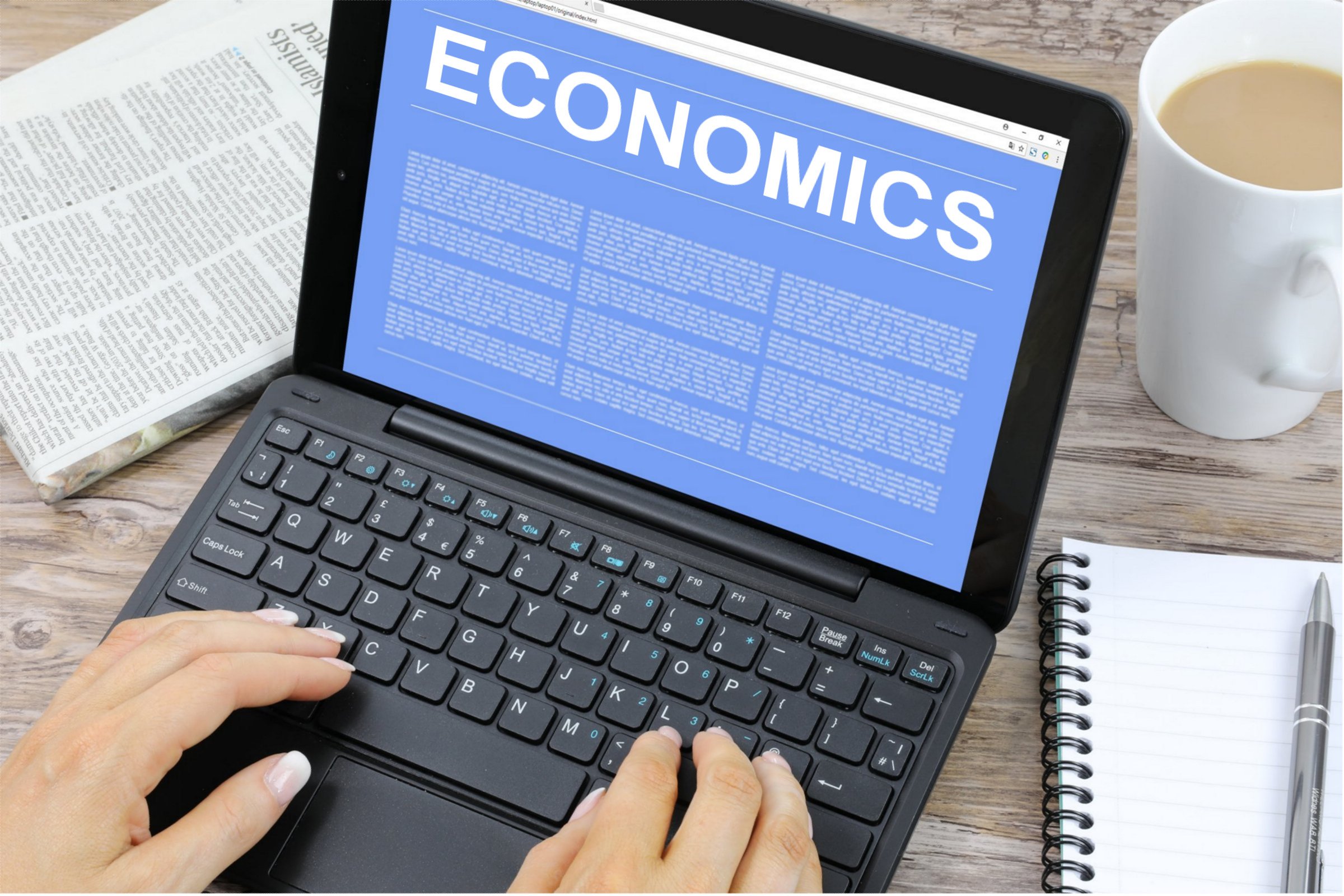 Economics slide on laptop - Best AI Tools to Answer Economics Questions