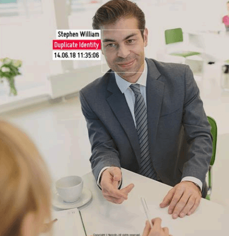 AI security system identifying duplicate identity attempt through facial recognition and biometric access control at a secure facility