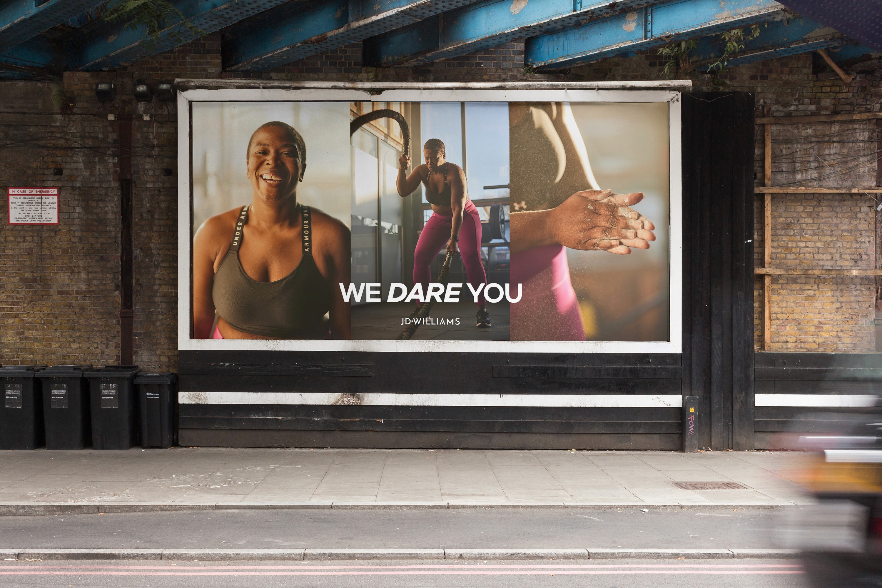Streetside billboard with flyposters of the Batch.Works brand and illustrations