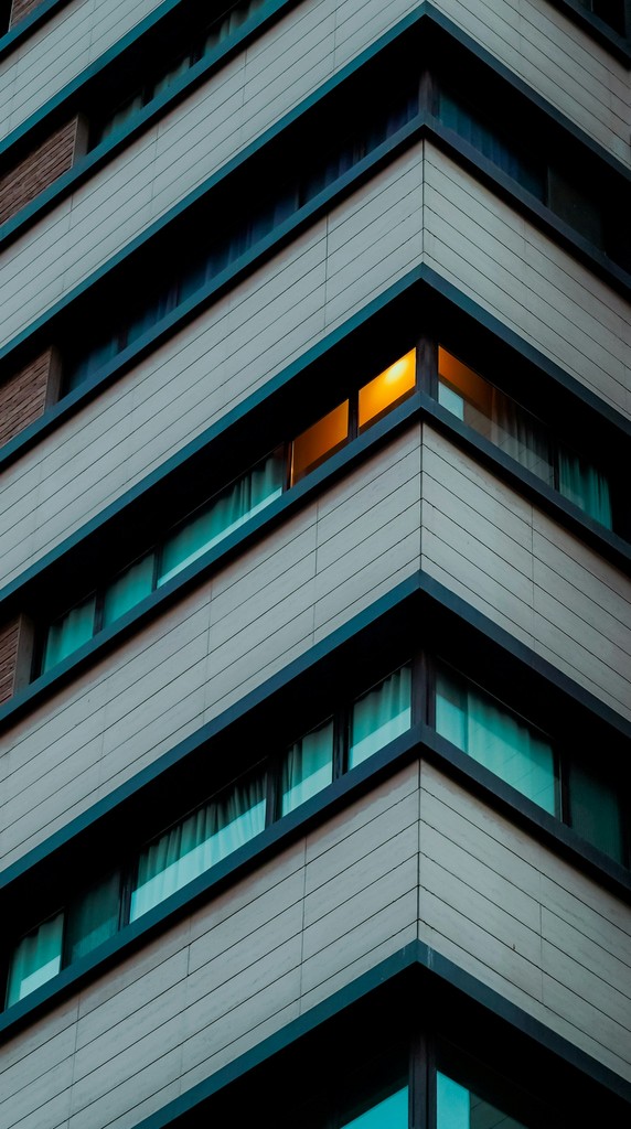 Corner of a modern building with illuminated window