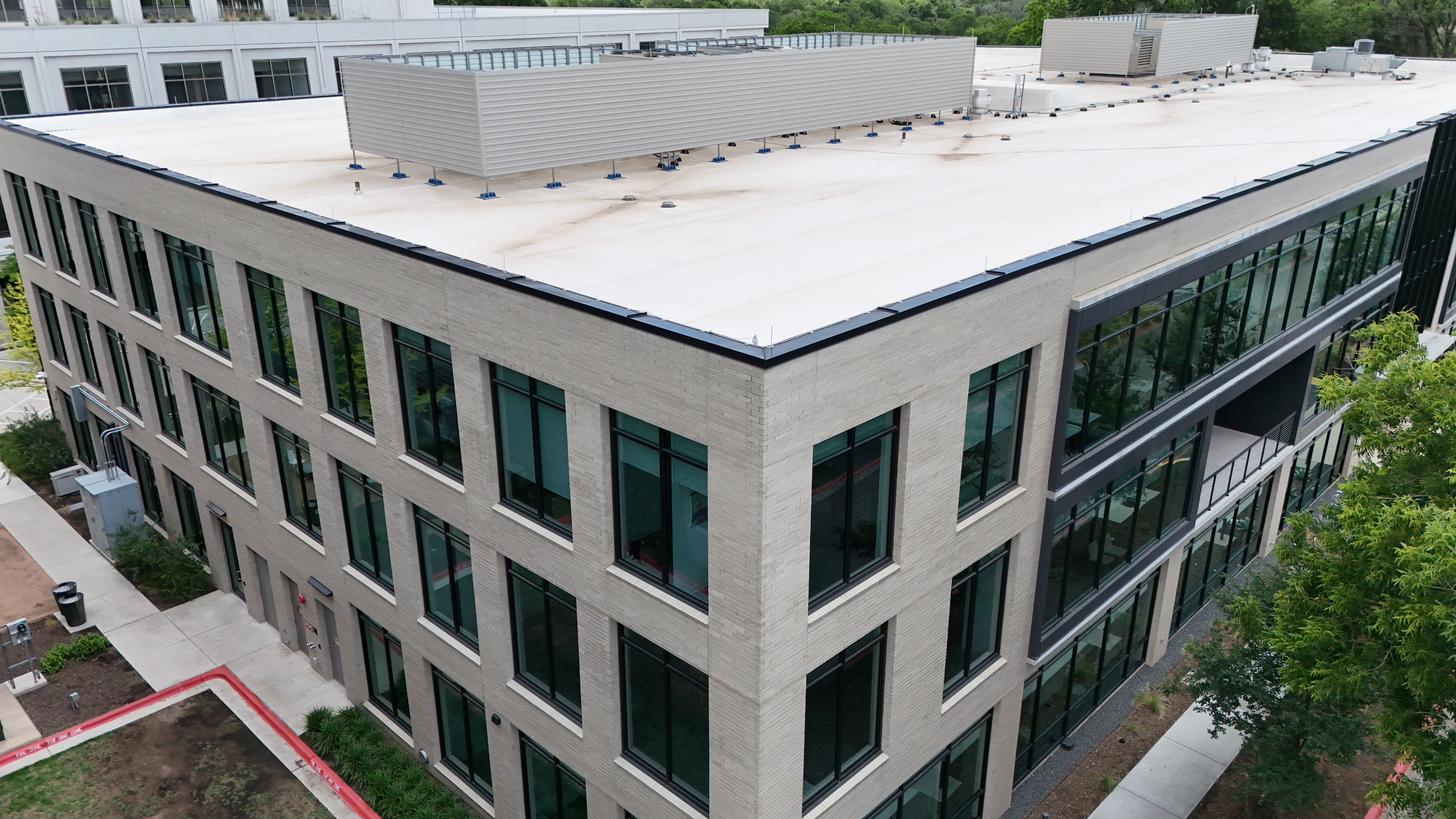 Commercial roofing building with black glass