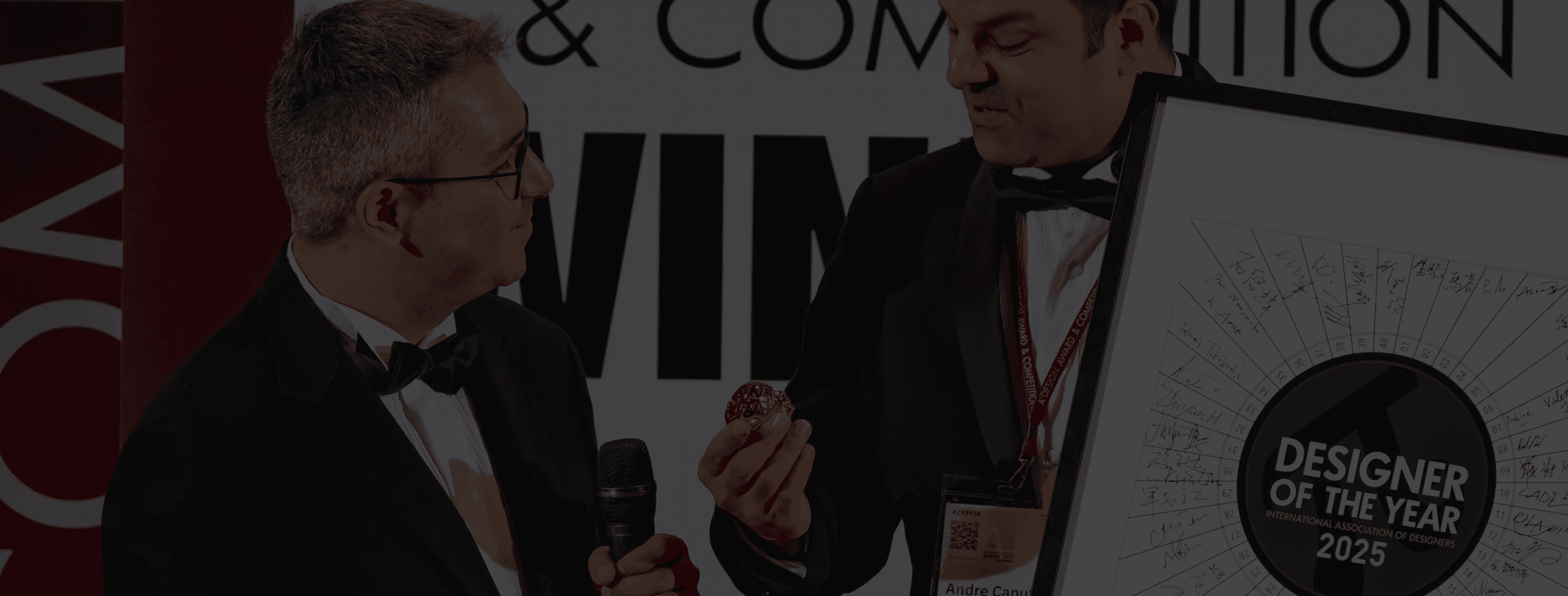 Black cosmetic product bottle against a dark background