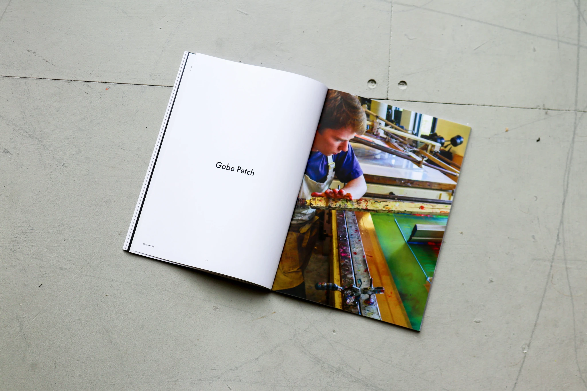 On Creativ-ity spread with a photo of a child painting