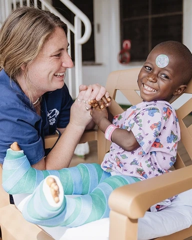 Volunteer woman with a young child