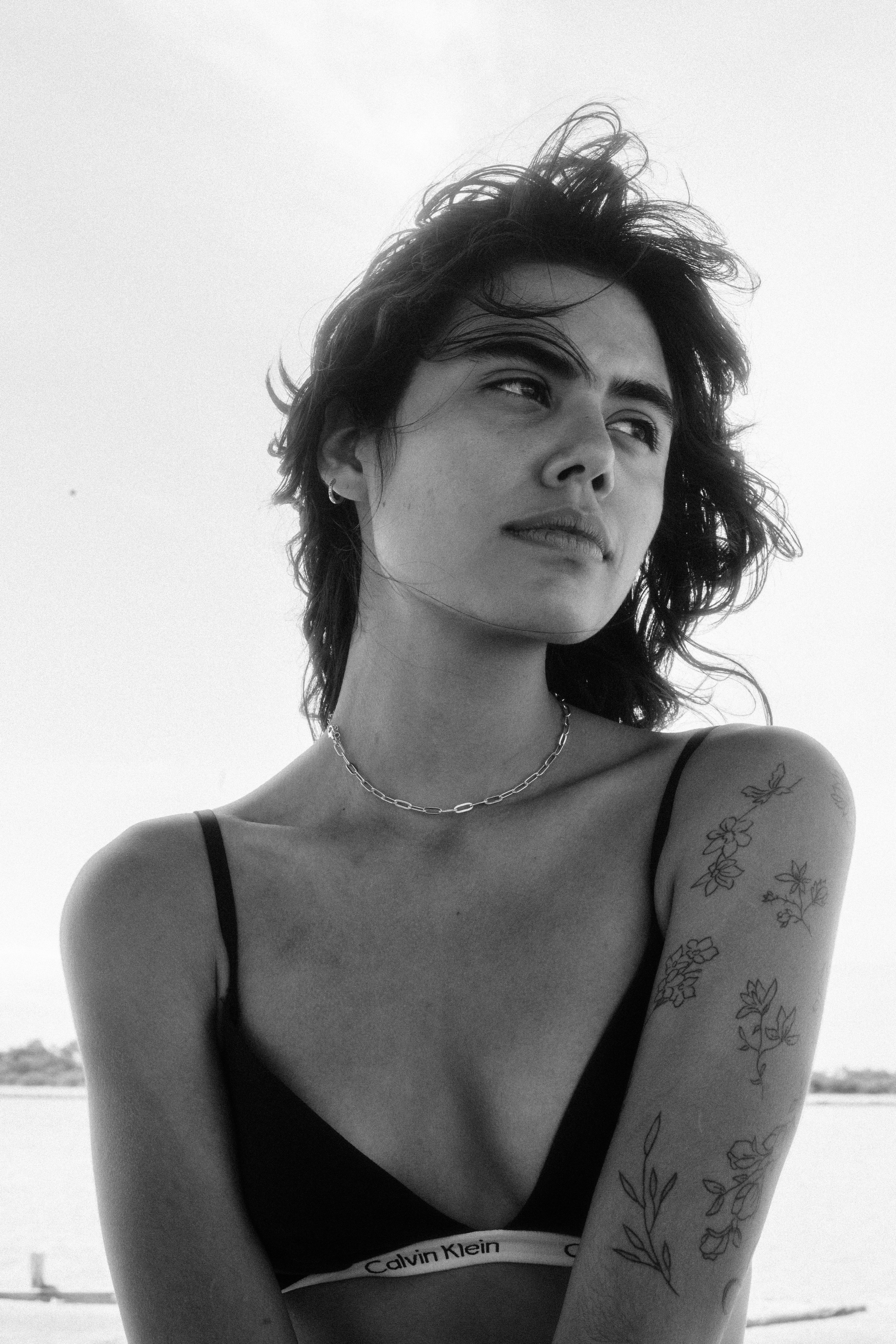 A bright white sky over sand dunes that stretch for miles