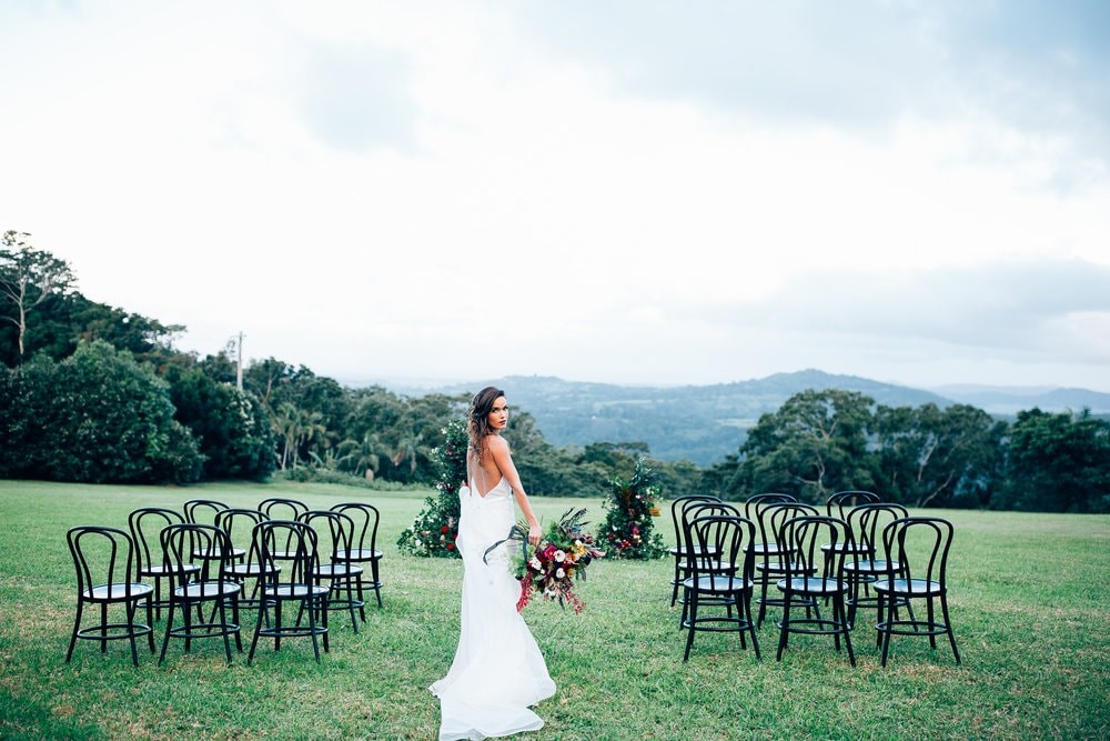 Bride posed at her aisle in the hinterland