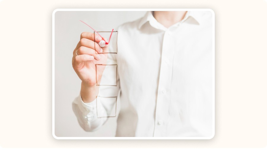 Person drawing comparison chart, selecting best option with marker&nbsp;