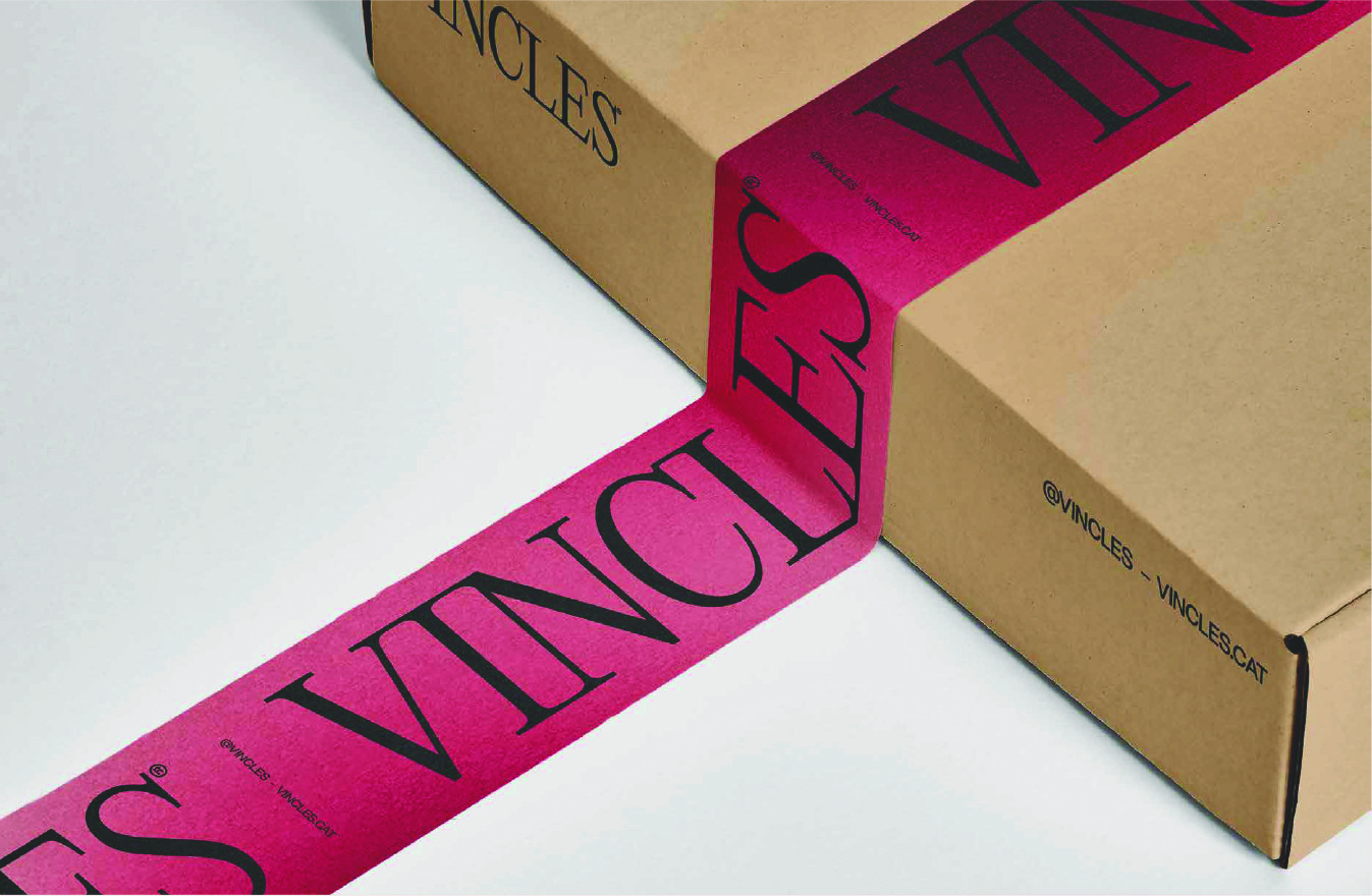Branded cardboard packaging sealed with custom paper tape featuring the visual identity and signature gradient graphics