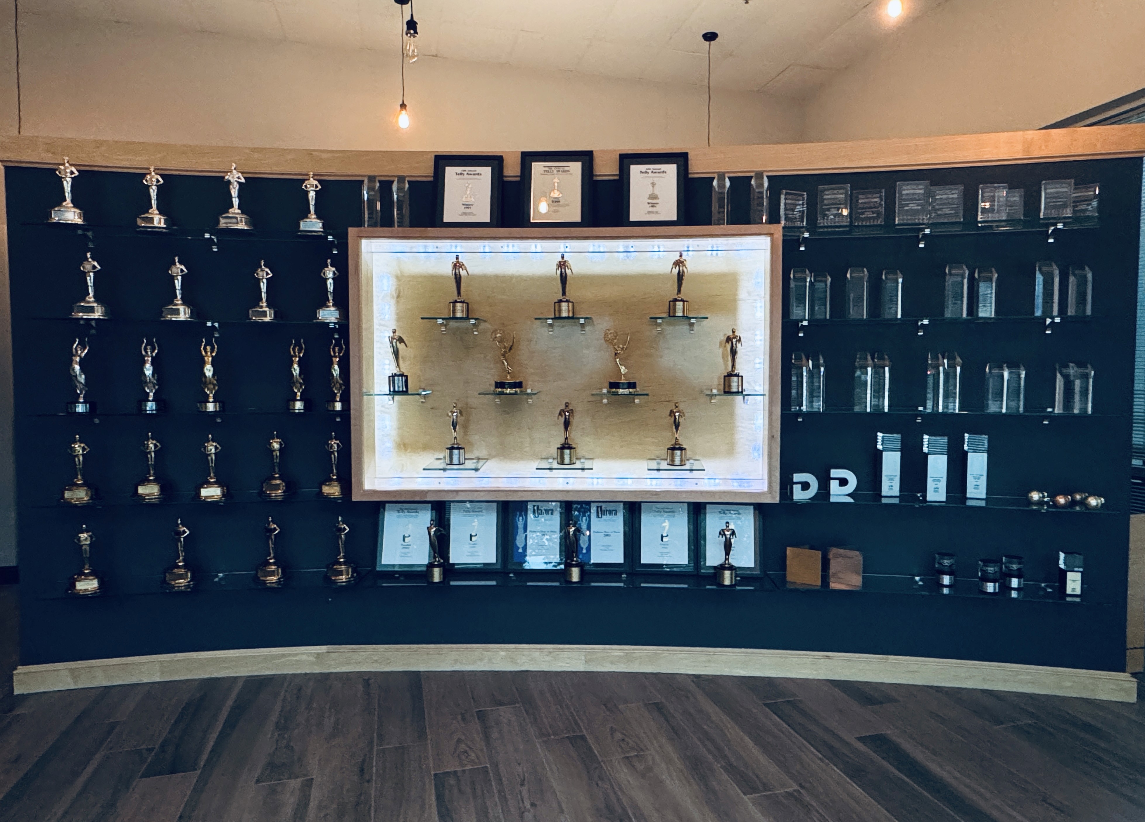 A wall of trophies and awards won by Corporate Magic